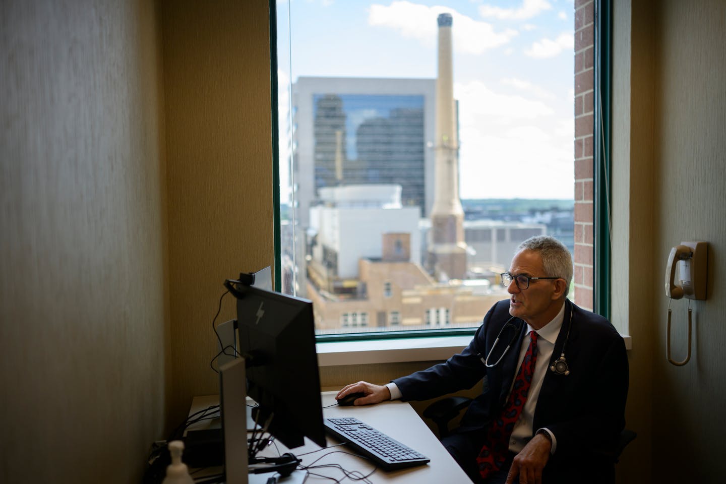 Dr. Paul Friedman looks over data from a patient’s smart watch, which the hospital’s AI systems analyze.