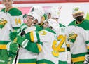 Jonas Brodin (25) and Kirill Kaprizov (97) along with Minnesota Wild teammates celebrated at the end of the game.