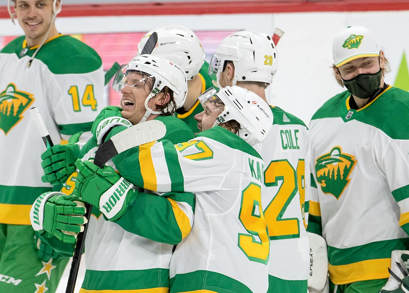 Jonas Brodin (25) and Kirill Kaprizov (97) along with Minnesota Wild teammates celebrated at the end of the game.