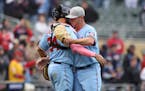 Minnesota Twins relief pitcher Emilio Pagan, right, celebrates with catcher Gary Sanchez (24) after defeating the Oakland Athletics in a baseball game