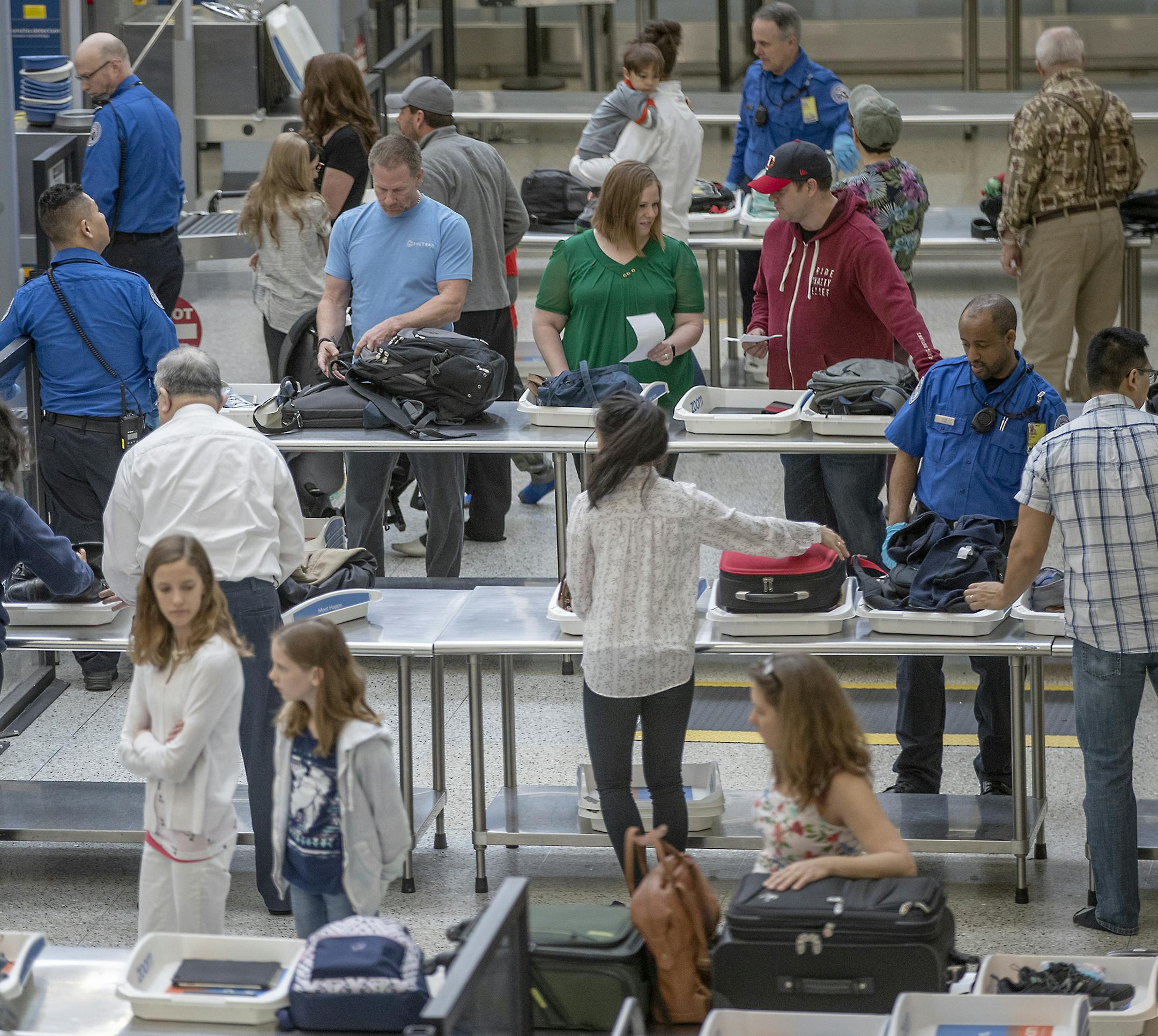 Travelers made their way through the TSA security at Terminal 1 at the Minneapolis/St. Paul International Airport, Thursday, May 23, 2019 in Bloomington, MN. Nearly 43 million Americans will take to the streets, rails and skies this summer beginning Memorial Day. The surge in expected travel comes despite gas prices increasing by more than 30 cents over the past two months nationally. Consumer spending remains strong, AAA says. ] ELIZABETH FLORES • liz.flores@startribune.com