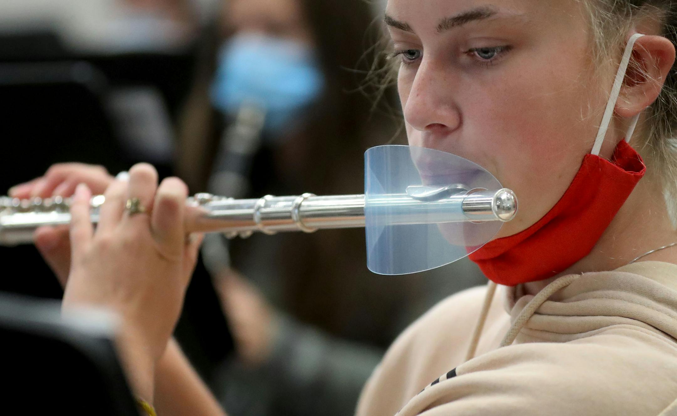 The pandemic has disrupted just about every part of school, but things are tough this year for band and choir programs but adjustments are making in person learning possible. Here, Alaina Morrow, a 10th grader, had a shield on her flute during band class Thursday, in Farmington. ] DAVID JOLES • david.joles@startribune.com Thursday, Sept. 17, 2020, in Farmington, MN. Band class for students at Farmington High -- pandemic style.**Bradley Mariska, Erin Holmes, Mason Voth, Jack Mahoney, Alaina Morro