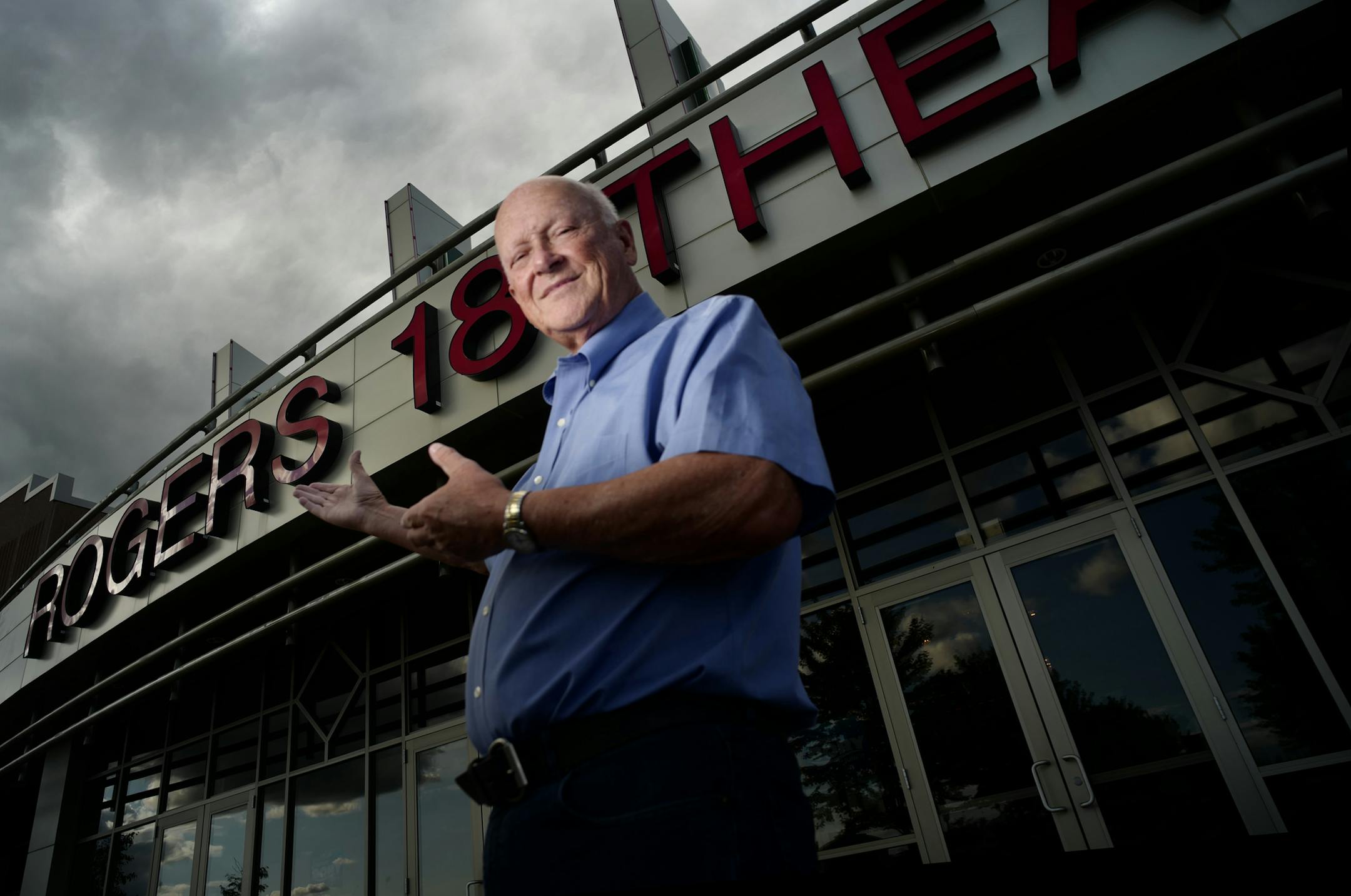 Mike Muller, in front of his Rogers 18 Theatre, nurtured Muller Family Theatres, which he and his brother Bob have sold to a Detroit company.
