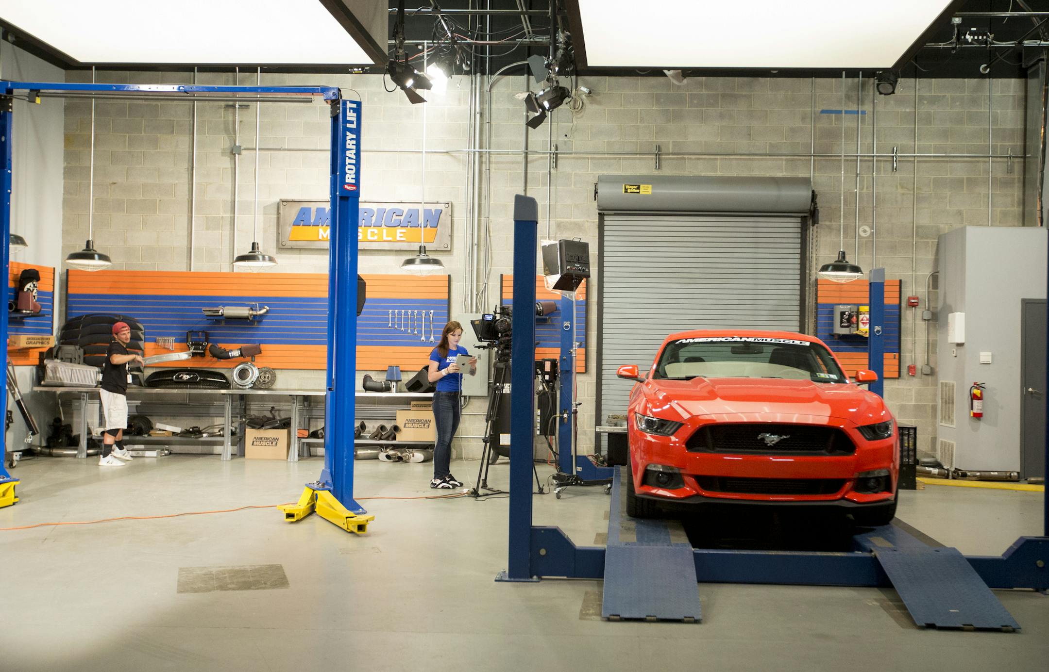 A Ford Mustang is in a video studio where Stephanie Wood hosts an American Muscle Youtube video on July 13, 2017. American Muscle is one of Turn5's brands. Steve and Andrew Voudouris, launched the ecommerce business in their parents basement in 2004.(Margo Reed/Philadelphia Inquirer/TNS) ORG XMIT: 1206599