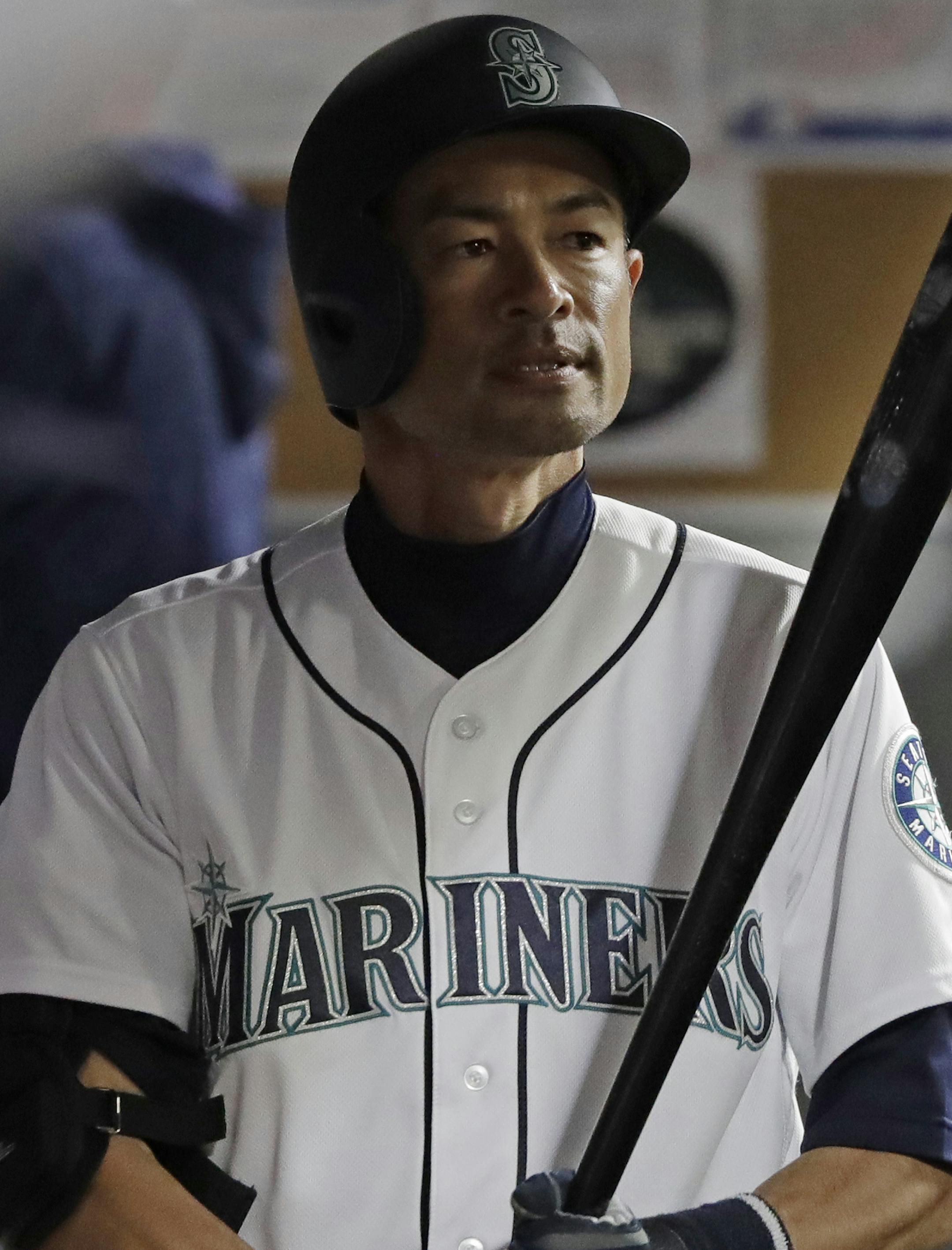 Seattle Mariners' Ichiro Suzuki holds his bat as he stands in the dugout after grounding out while pinch hitting in the eighth inning of a baseball game against the Houston Astros, Wednesday, April 18, 2018, in Seattle. The Astros won 7-1. (AP Photo/Ted S. Warren)