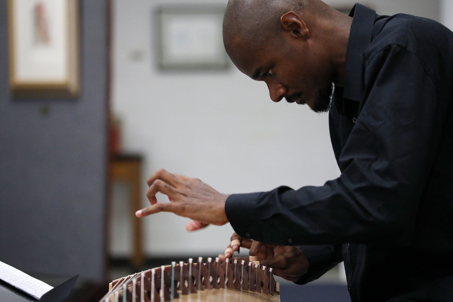 Jarrelle Barton practiced the guzheng, or Chinese zither, at the Anderson Center near Red Wing. He was 13 when he discovered the instrument from a CD of traditional Chinese music he checked out of the library. He ordered his first guzheng online and has since taught himself Mandarin to watch instructional videos on YouTube.