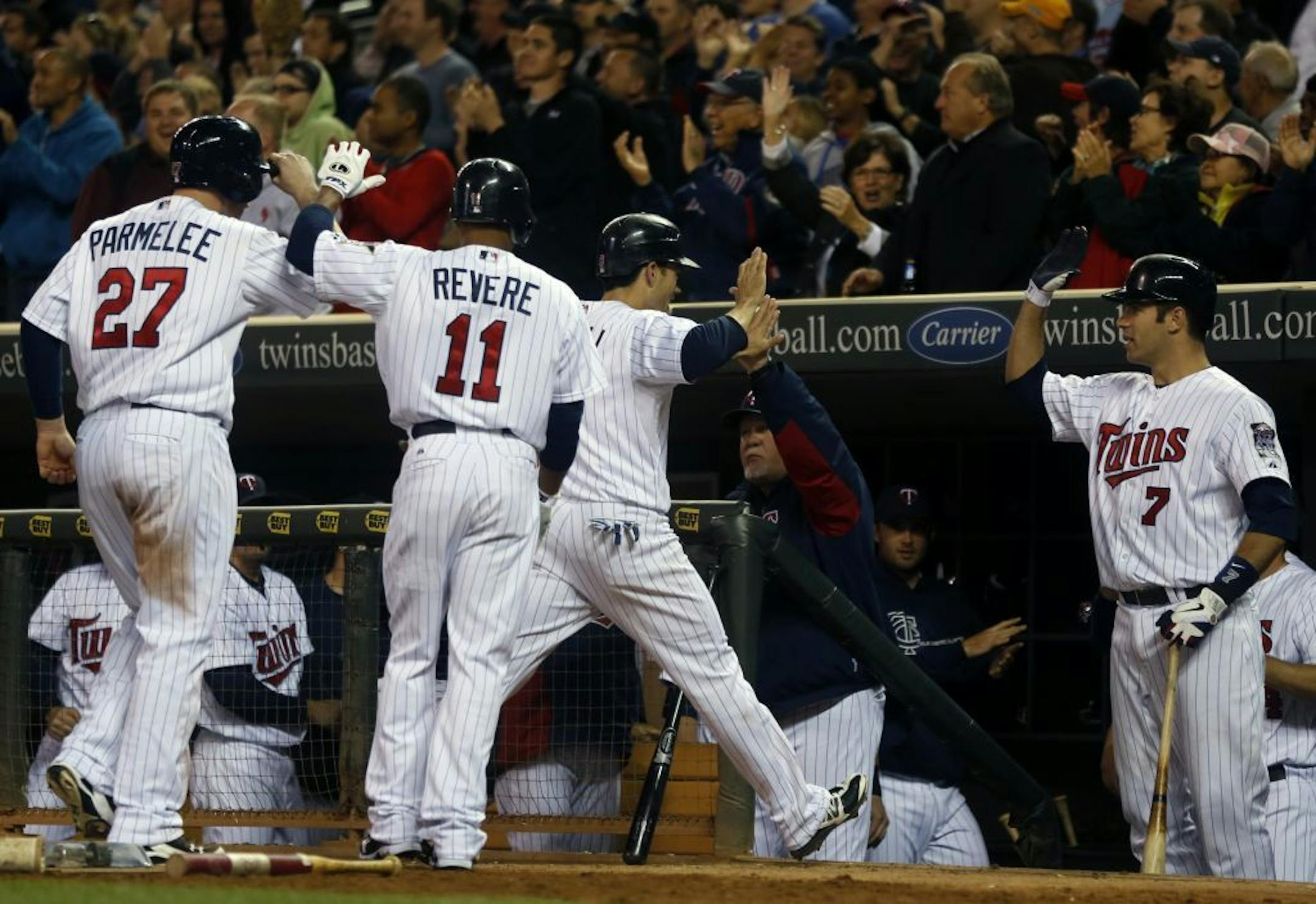 Twins players celebrate a double by Denard Span in the bottom of the seventh inning, helping a comeback victory over the Yankees.