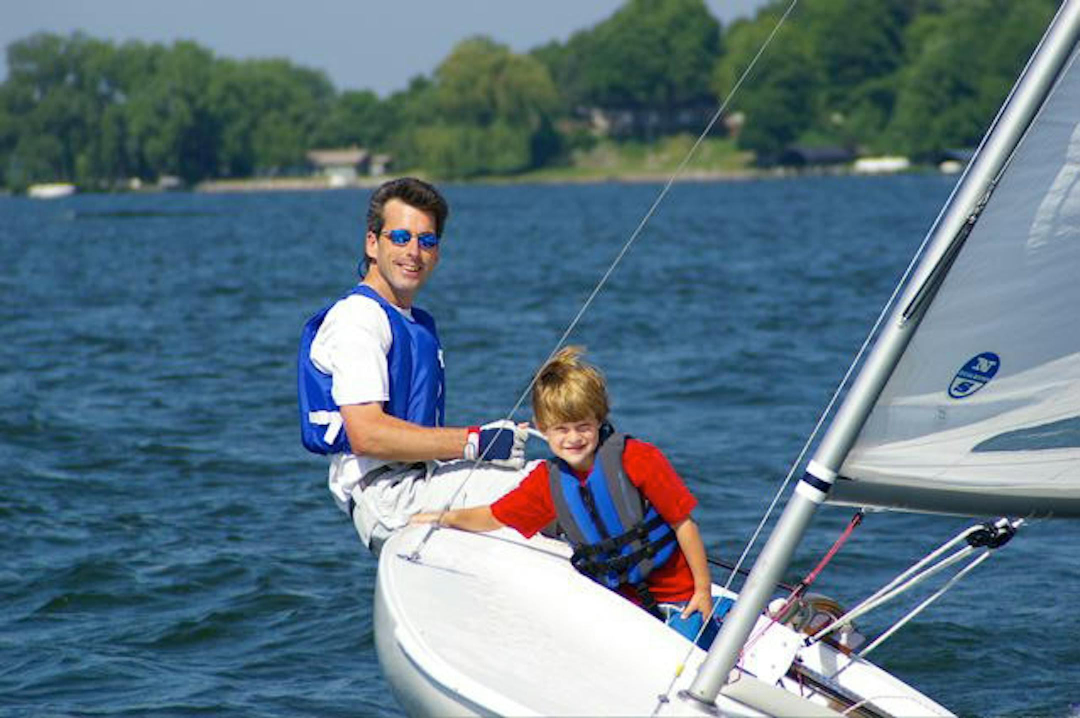 The Upper Minnetonka Sailing School will launch its new summer program in June. Pictured: school president Keith Morical and nephew Victor Nelson.