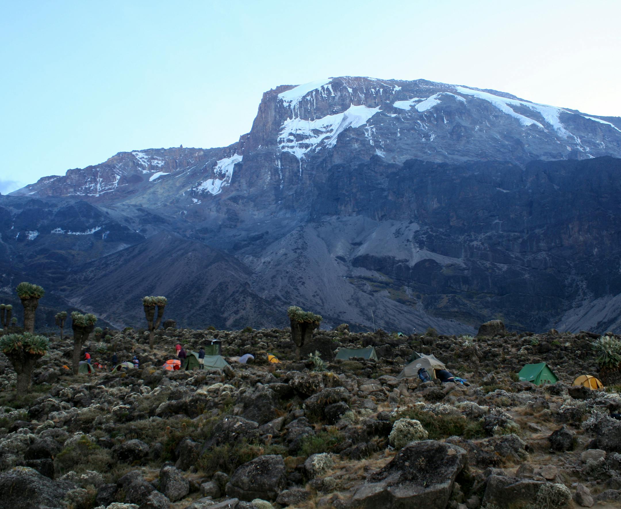 Ben and Andrea Brandt (Me and my mom) Edina. Her sister (my aunt), Caroline DeVinck was also with us. She lives in Minneapolis It was about 7am on the 4th day of the hike on the Machame Route at the Barranco campsite, elevation around 13,000 feet. This pictures is taken of a couple campsites in the shadow of Uhuru peak, the tallest peak of the three peaks of Kilimanjaro, 19,341 feet. It was this past August. We climbed with the company Climb Kili. After the hike, we did a safari in Serengeti Nat