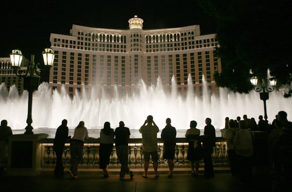 Tourists line up in front of the Bellagio in Las Vegas to watch the water show.