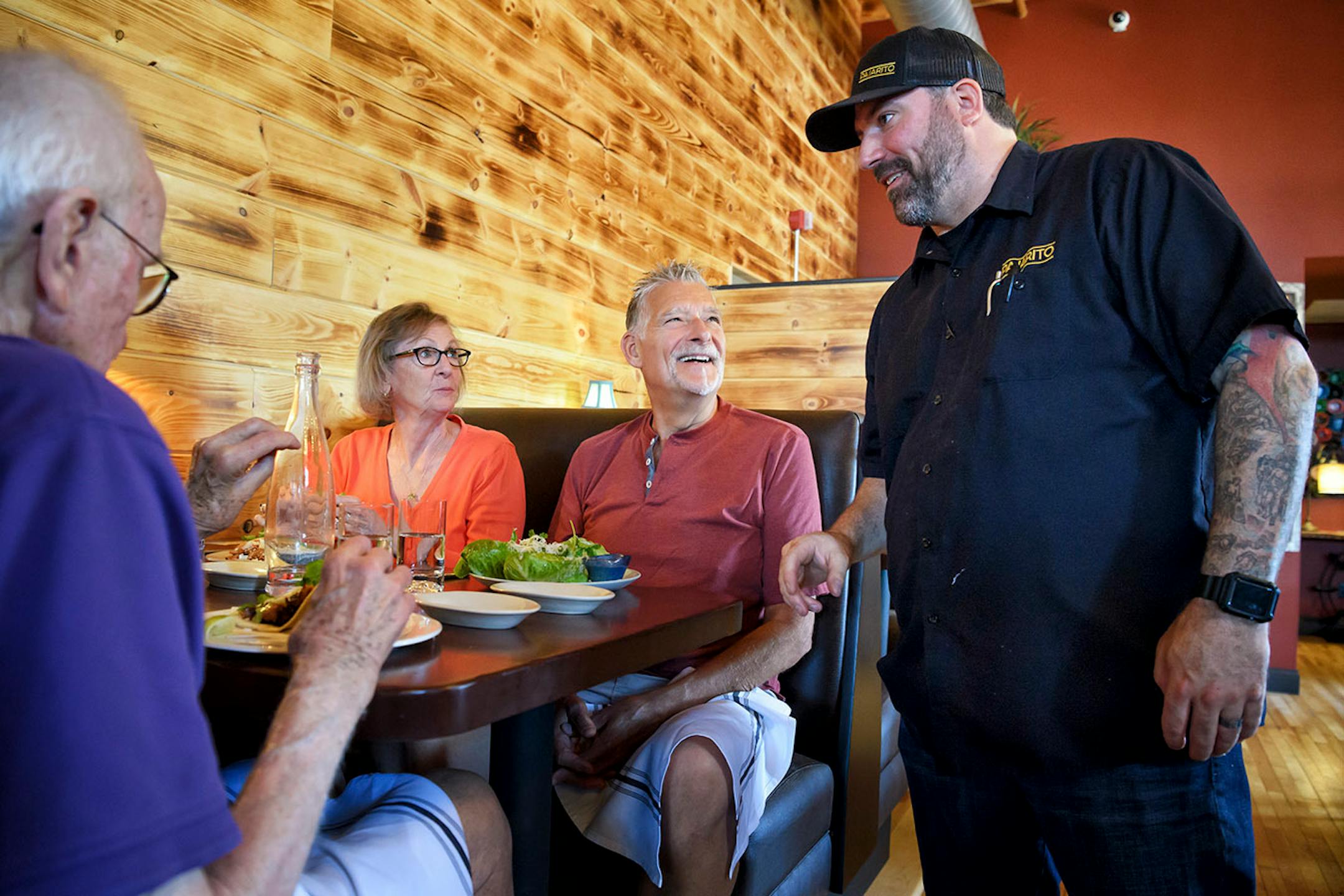 Pajarito co-owner Stephan Hesse talked with first time customers Jan and Chuck Buzicky, center.