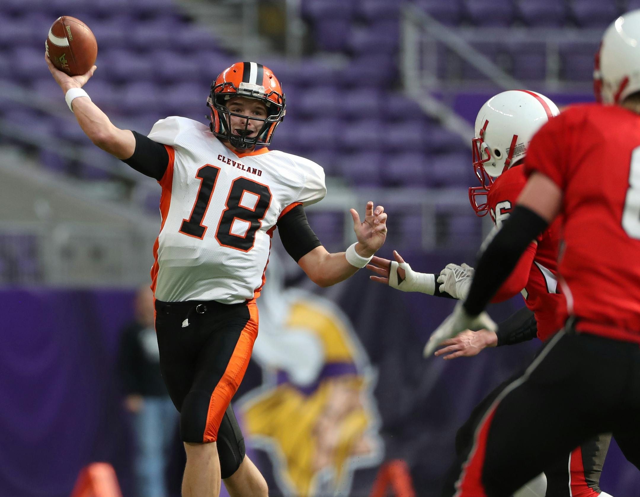 Cleveland quarterback Carter Kopet passed on a scramble against Cromwell-Wright in a Nine-Man semifinal last week.
