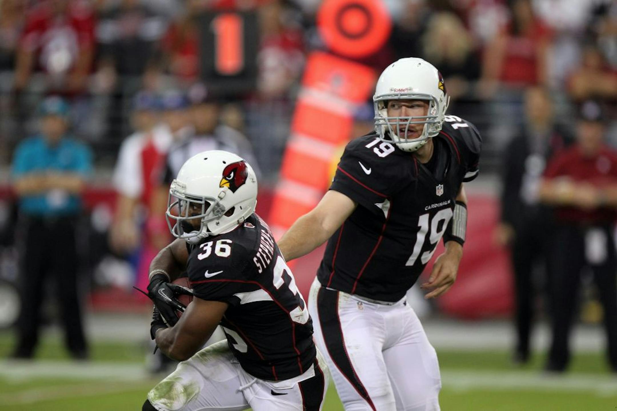 Arizona Cardinals' LaRod Stephens-Howling, left, takes the handoff from quarterback John Skelton against the Buffalo Bills in an NFL football game Sunday, Oct. 14, 2012, in Glendale, Ariz.