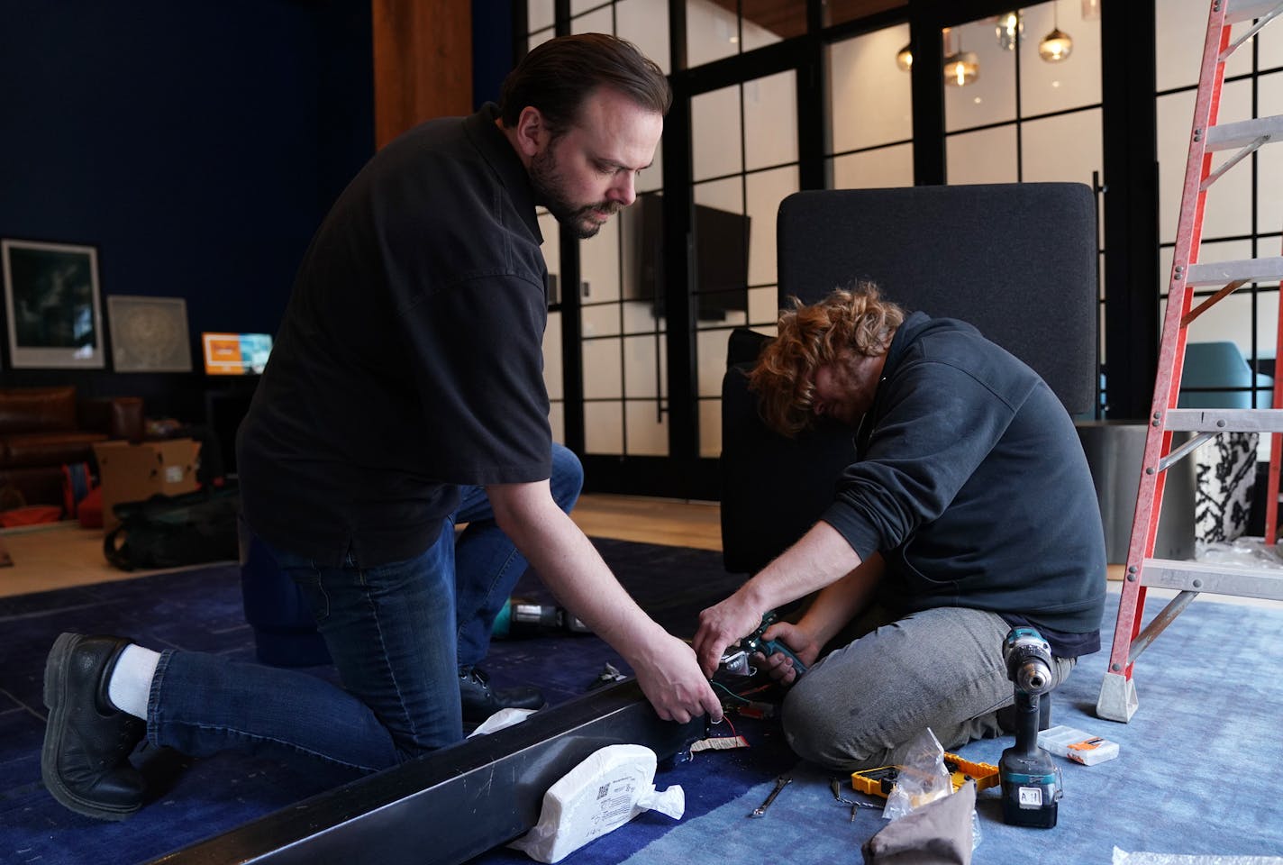 In-Focus Systems commercial division head Shaun Chambers and site foreman Andrew Henriksen worked to install a 133-inch projection screen and Epson 4k projector to show the Final Four in the guest retreat at the new Canopy Hotel Wednesday. ] ANTHONY SOUFFLE &#x2022; anthony.souffle@startribune.com A crew from In-Focus Systems worked to install a 133-inch projection screen and Epson 4k projector to show the Final Four in the guest retreat at the new Canopy Hotel Wednesday, April 3, 2019 in Minnea