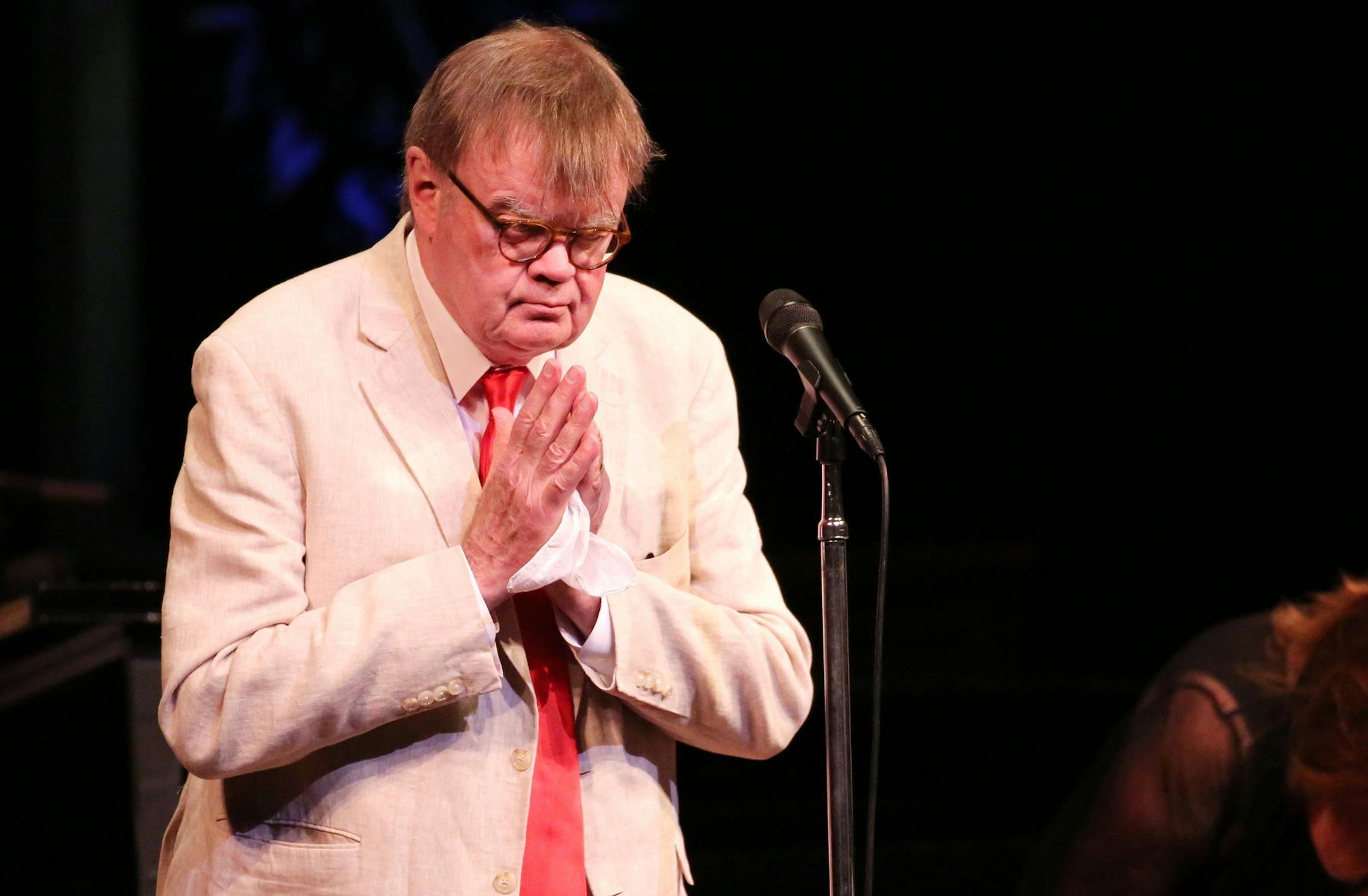 Garrison Keillor clasps his hands together and gently bows after hearing an audience member came from Japan and was at the show during his final Prairie Home Companion" Saturday, Feb. 27, 2016, at the Fitzgerald Theatre in St Paul, MN.](DAVID JOLES/STARTRIBUNE)djoles@startribune.com Garrison Keillor may not be saying goodbye to "Prairie Home Companion" just yet, but Saturday night's show will be his last at the Fitzgerald Theatre.