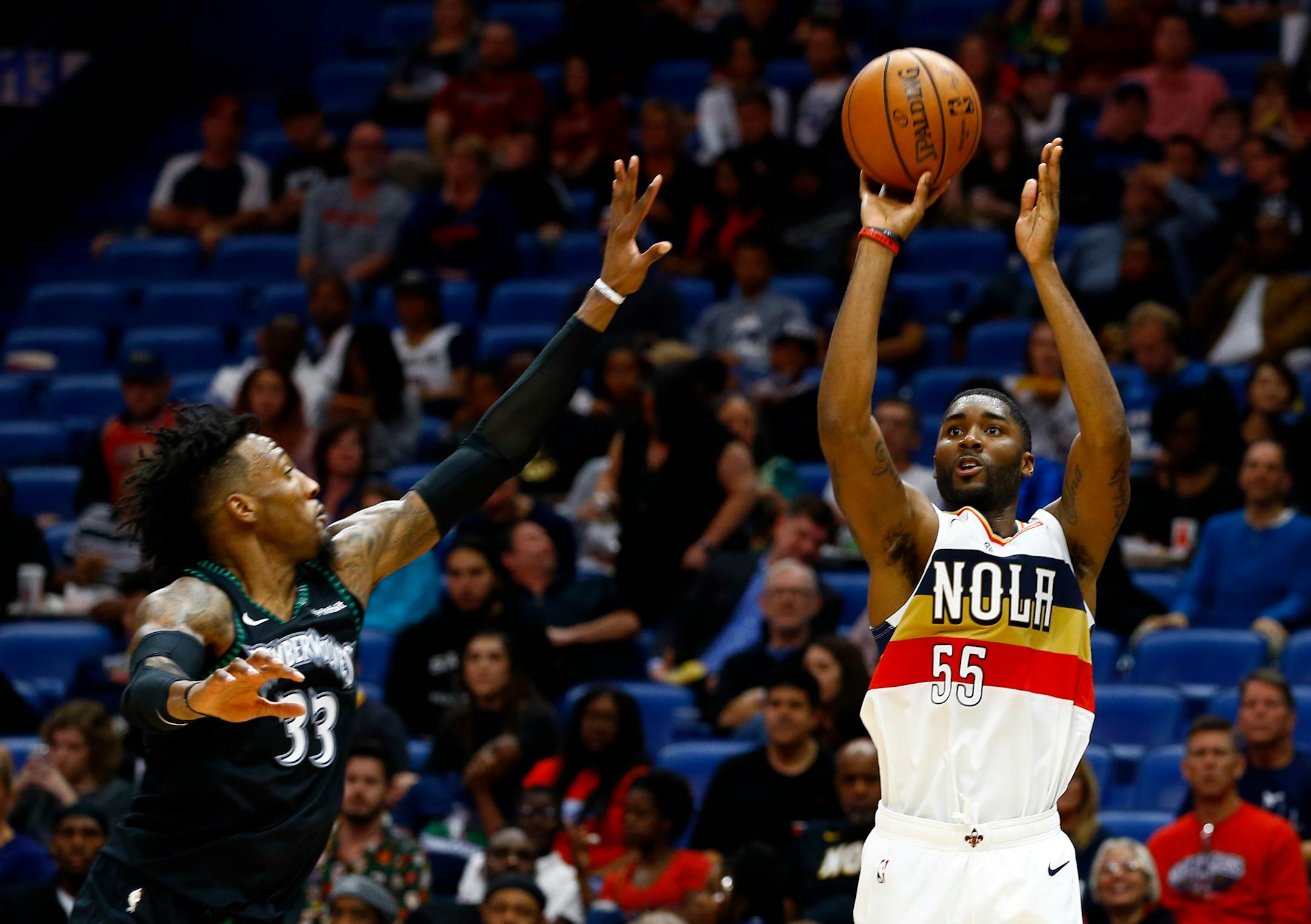 New Orleans guard E'Twaun Moore shoots as Timberwolves forward Robert Covington tries to defend during the second half of a game Dec. 31. Tom Thibodeau was fired three games later.