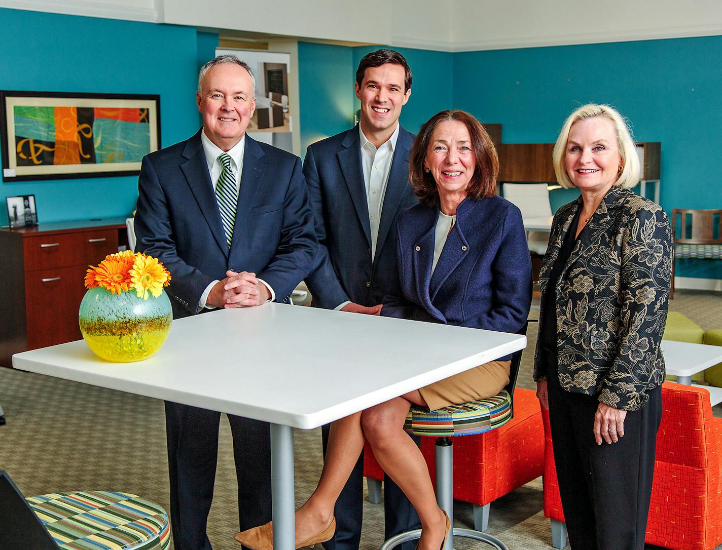 James Droney, President, Chris Droney, Vice President and General Manager, Rosemary Droney, and Debra Krumenacker, Executive Vice President, pose for a portrait in the showroom of Mt. Lebanon Office Furniture & Interiors, in Beechview on Nov. 23, 2016. (Andrew Rush/Pittsburgh Post-Gazette) ORG XMIT: 1195021