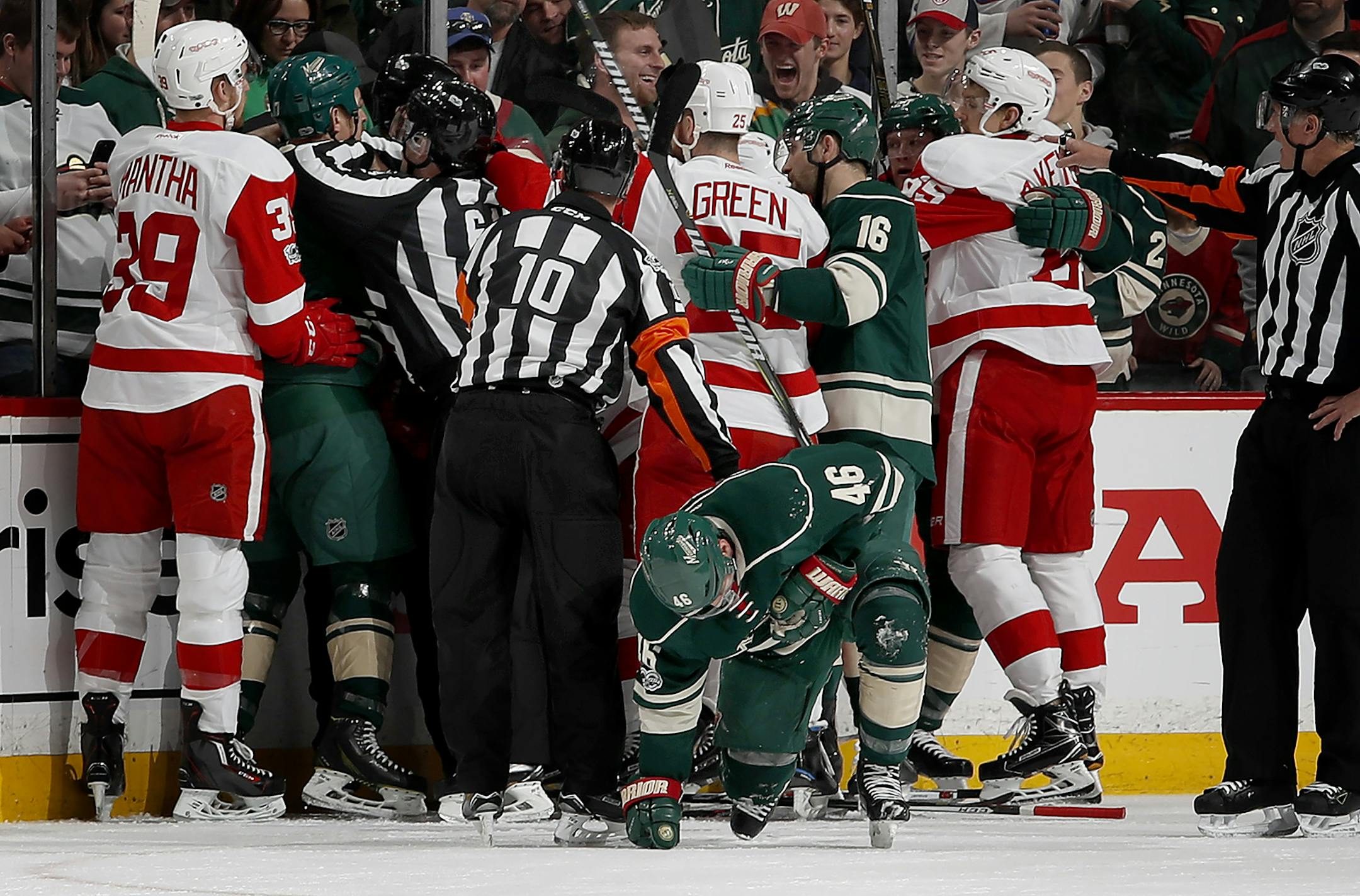 The Wild and Red Wings converged as Jared Spurgeon (46) tried to get up off the ice after taking a stick to the face in the first period. ] CARLOS GONZALEZ &#xef; cgonzalez@startribune.com - February 12, 2017, St. Paul, MN, Xcel Energy Center, NHL, Hockey, Detroit Red Wings at Minnesota Wild