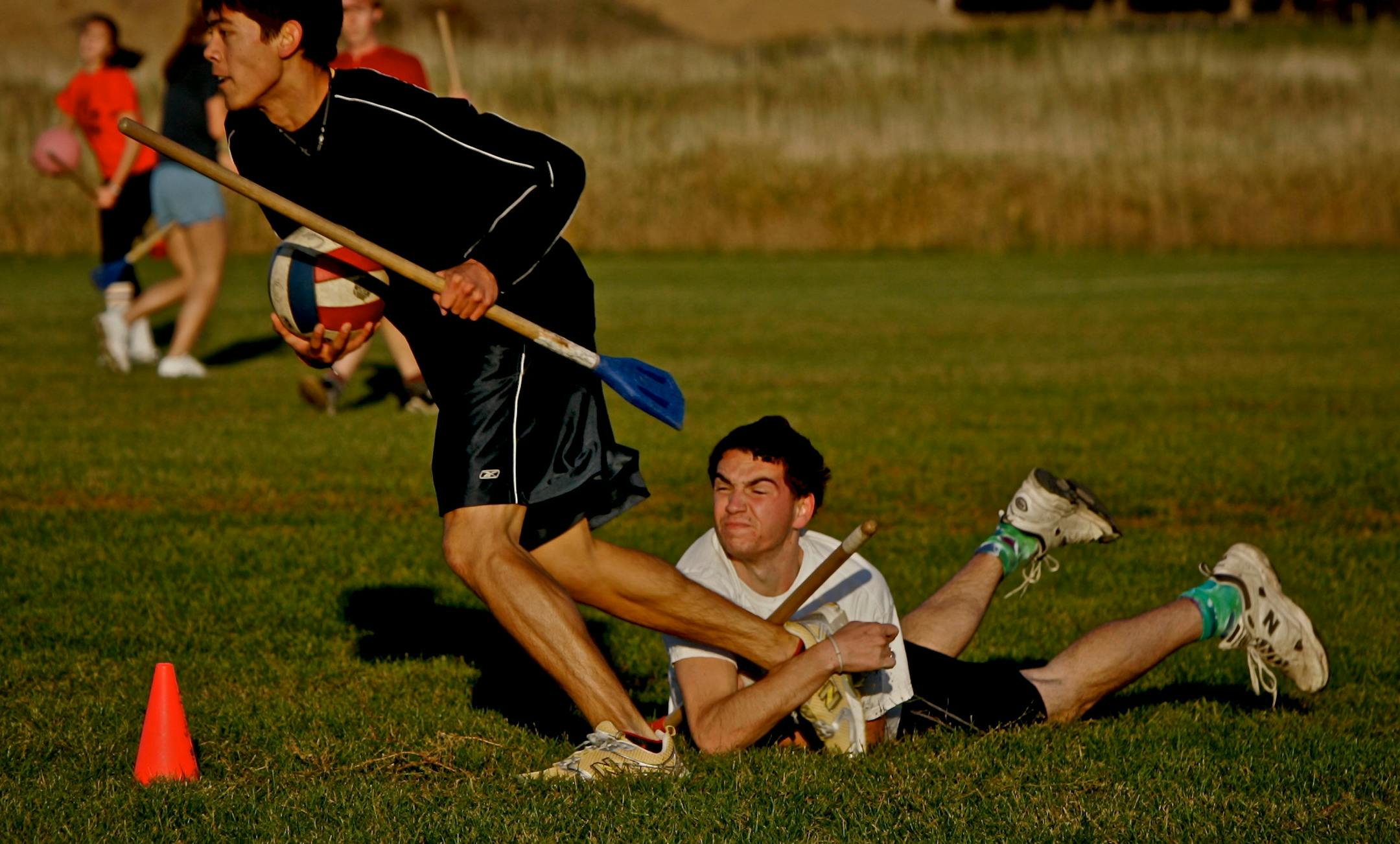 Rob Kaye holds onto the leg of Kiyota Gom to try to keep him from scoring. Kaye lost his grip and Gum scored.