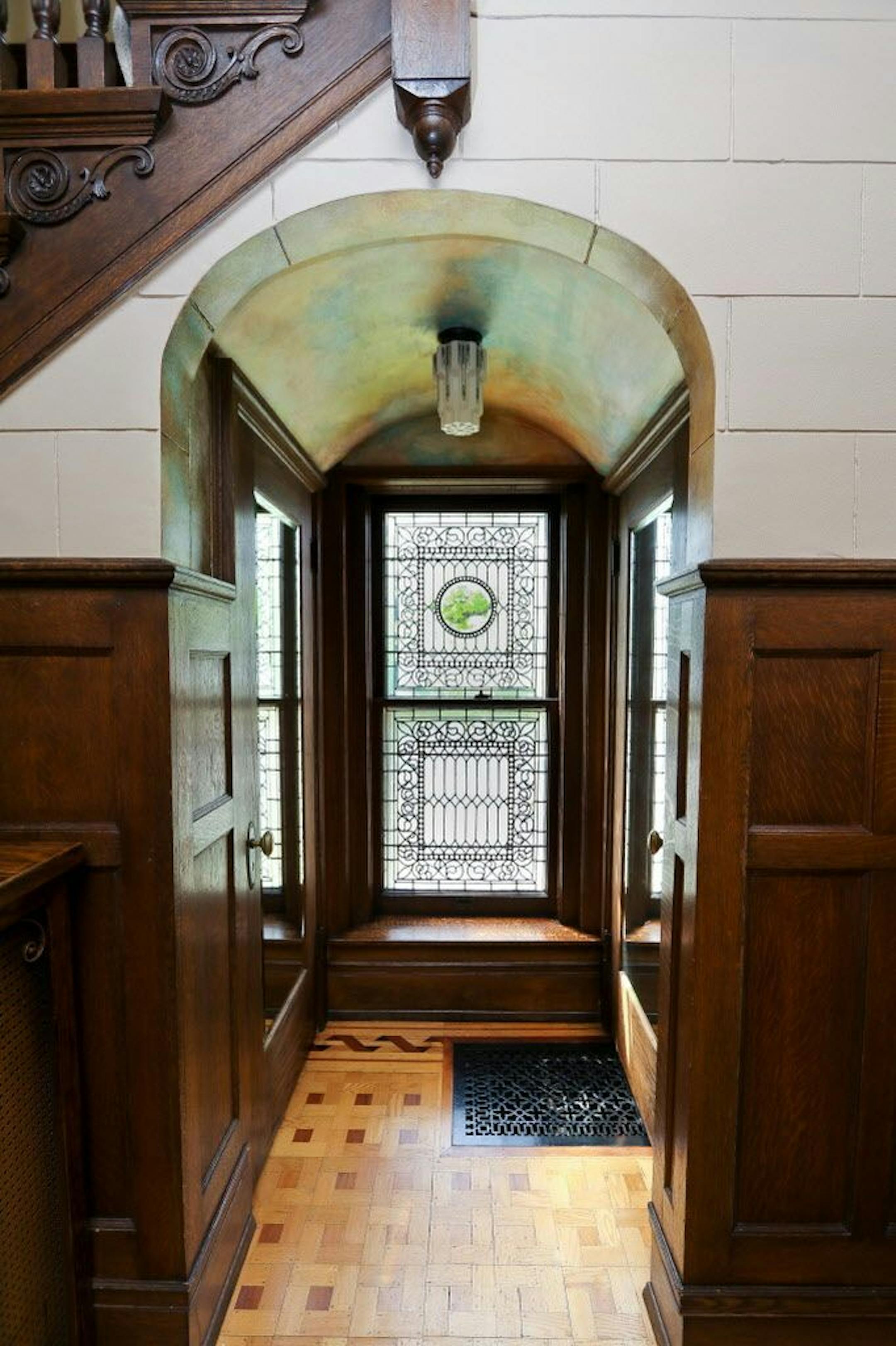 Arched alcove and leaded-glass window in the mansion.
