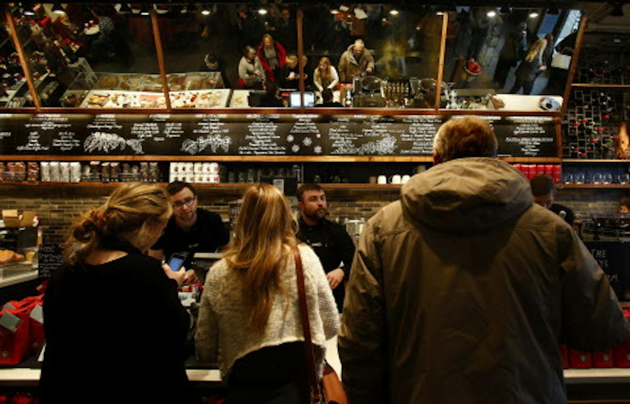Starbucks' departure from the norm is on display at the Reserve store in University Village in Seattle, Dec. 12, 2013, with its mirrors and chalkboard menus. (Alan Berner/Seattle Times/MCT) ORG XMIT: 1147171