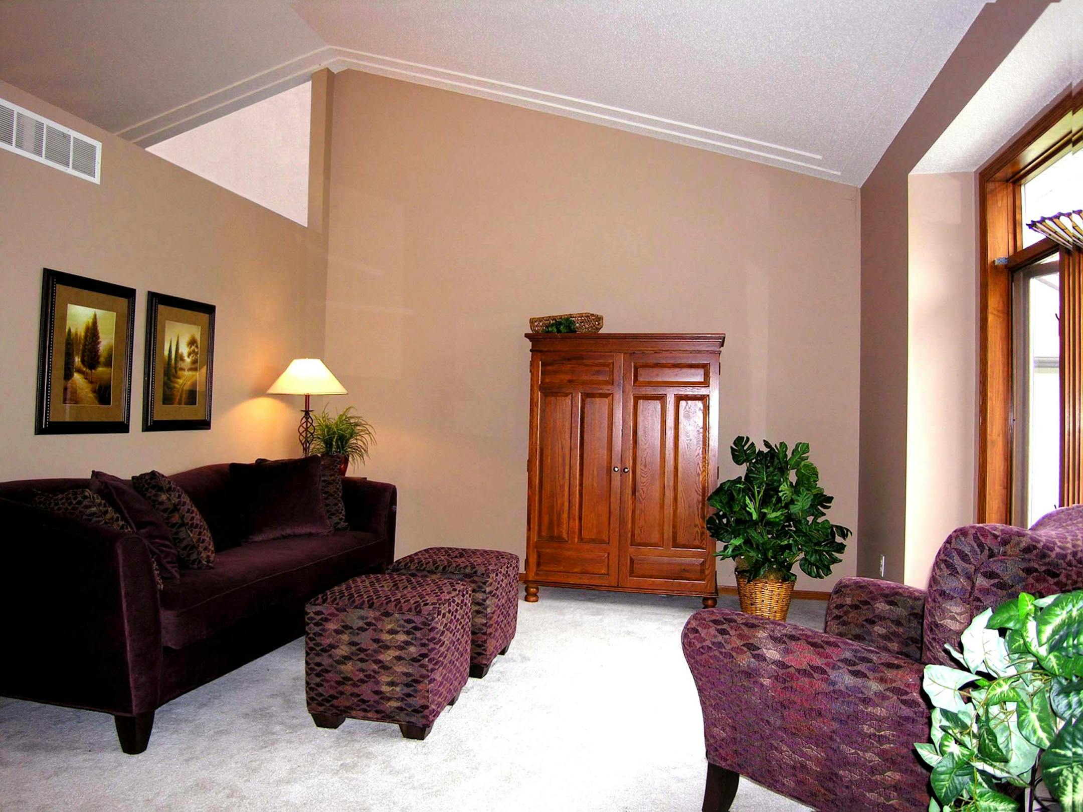 The furniture was rearranged and smaller pieces made for better scale in the room.