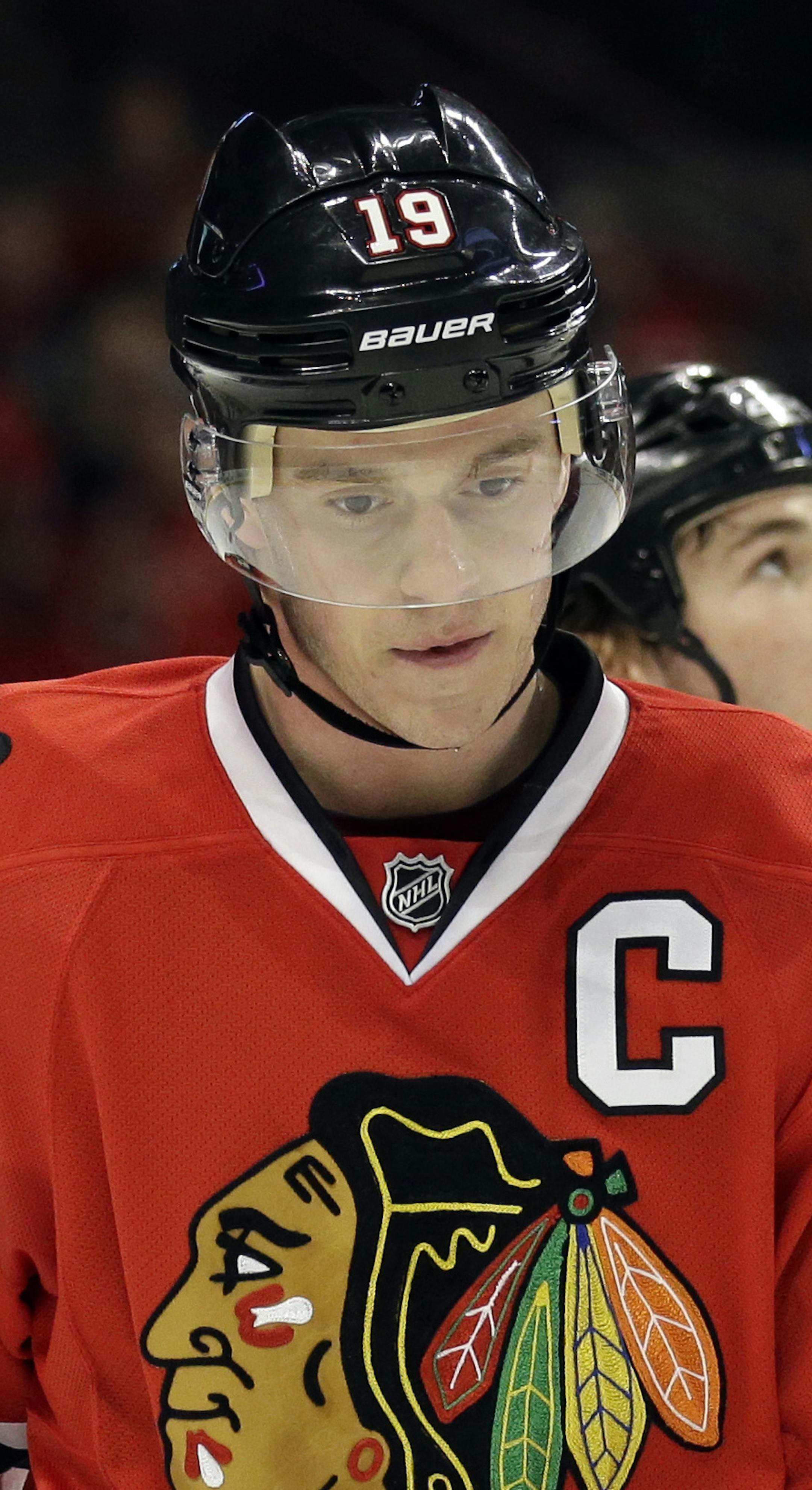 Chicago Blackhawks' Jonathan Toews (19) looks down as he skates to the bench during the second period of an NHL hockey game against the Nashville Predators in Chicago, Sunday, March 23, 2014. (AP Photo/Nam Y. Huh)