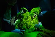 Reed Sigmund is expressive and funnily haunting as the title character in “Dr. Seuss’s How the Grinch Stole Christmas” at the Children’s Theat