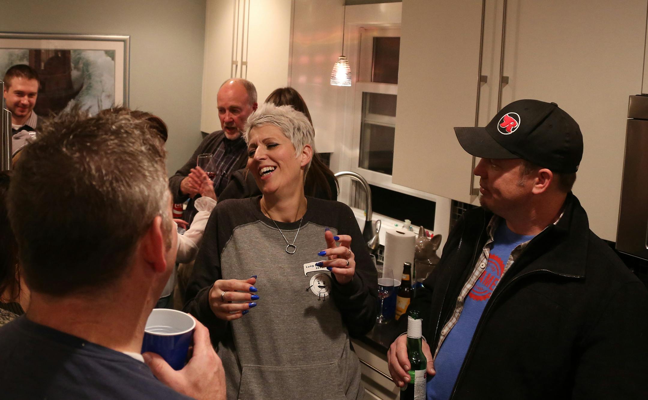 Heather Von St. James chatted with guest that came to celebrate her nine years of survival of mesothelioma. ] (KYNDELL HARKNESS/STAR TRIBUNE) kyndell.harkness@startribune.com At the ninth annual LungLeavin' Day in Roseville, Min., Saturday, February 7, 2015.
