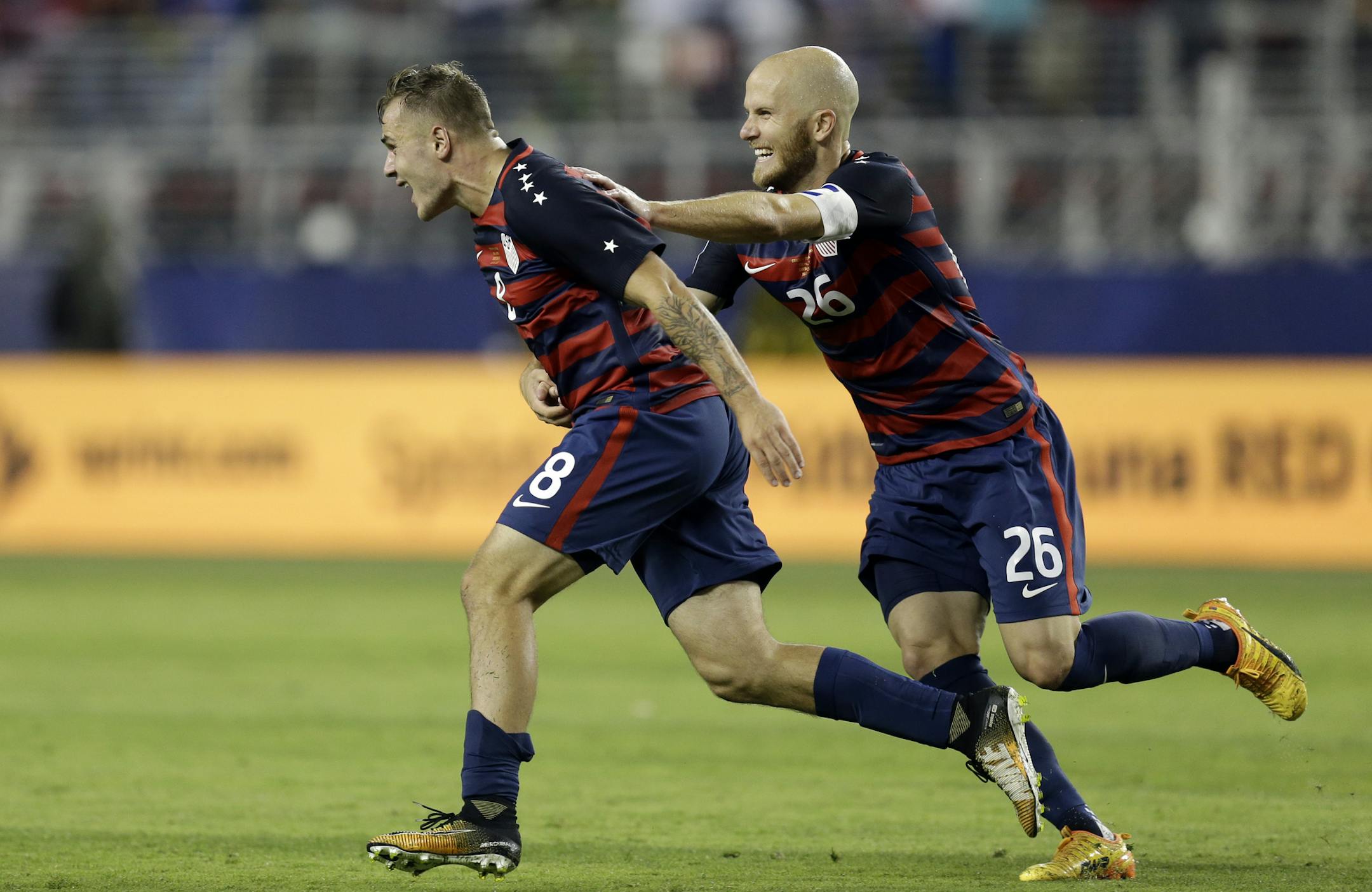 United States' Jordan Morris (8) and Michael Bradley celebrate after Morris scored a goal against Jamaica during the second half of the Gold Cup final soccer match in Santa Clara, Calif., Wednesday, July 26, 2017. (AP Photo/Ben Margot)