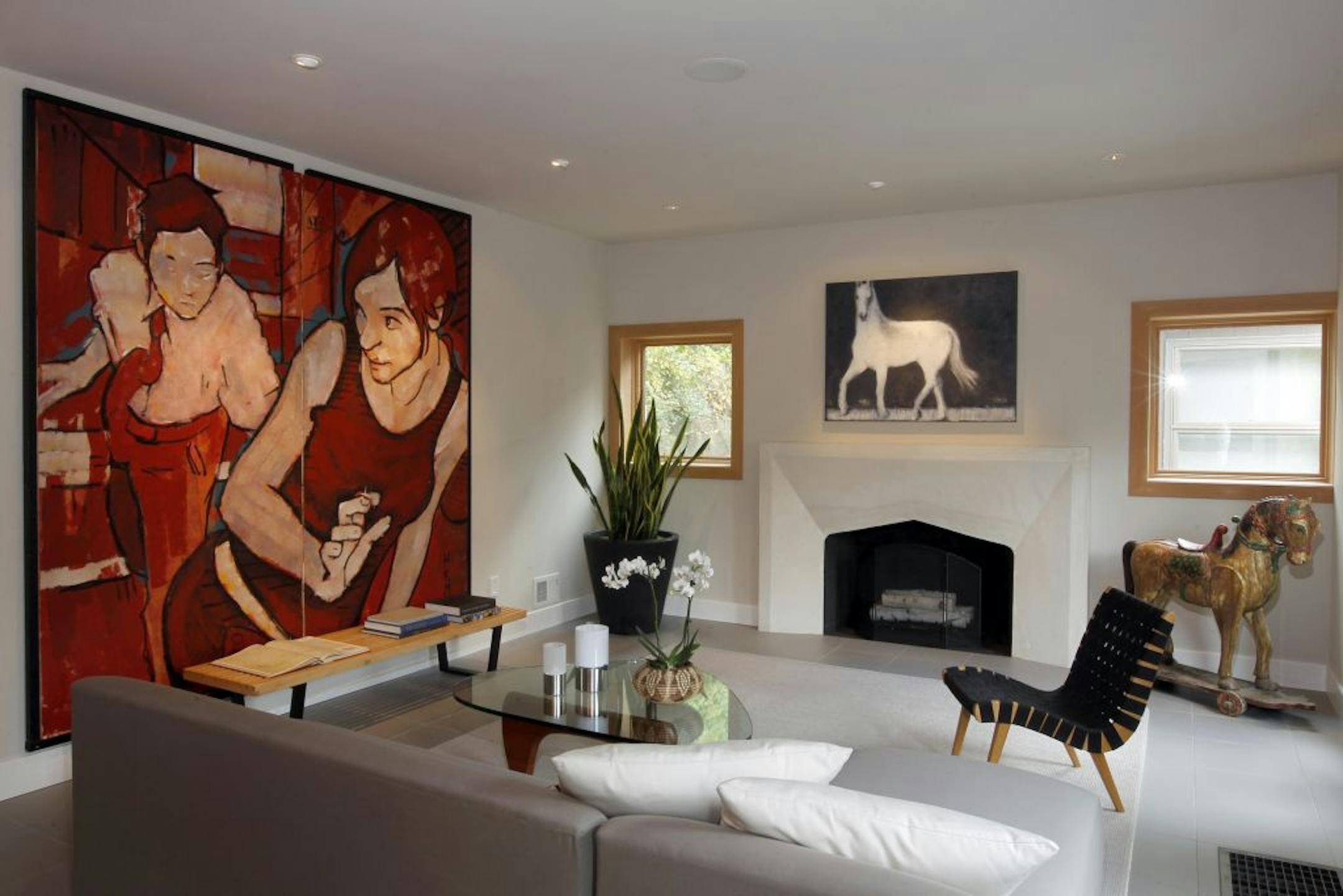 TOM WALLACE • twallace@startribune.com _ Bryce and Natalie Quinn's 1925 Mediterranean-style home was gutted and remodeled in an edgy, contemporary style. The couple did a most of the work themselves with friends. It's furnished by room and board where Natalie works and lots of local artwork the couple has collected over the years. The livingroom.