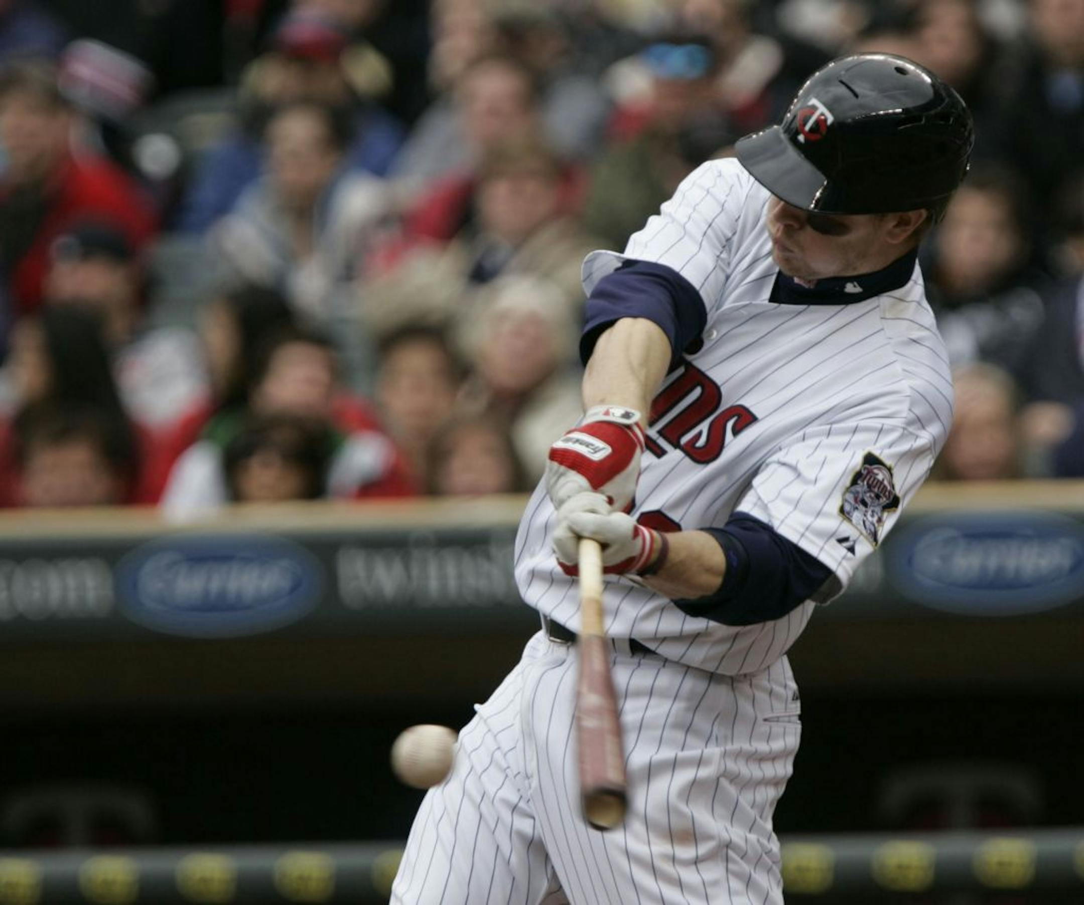 Twins Justin Morneau hit and scored a run in the fifth inning. Twin beat the Indians 10-3.