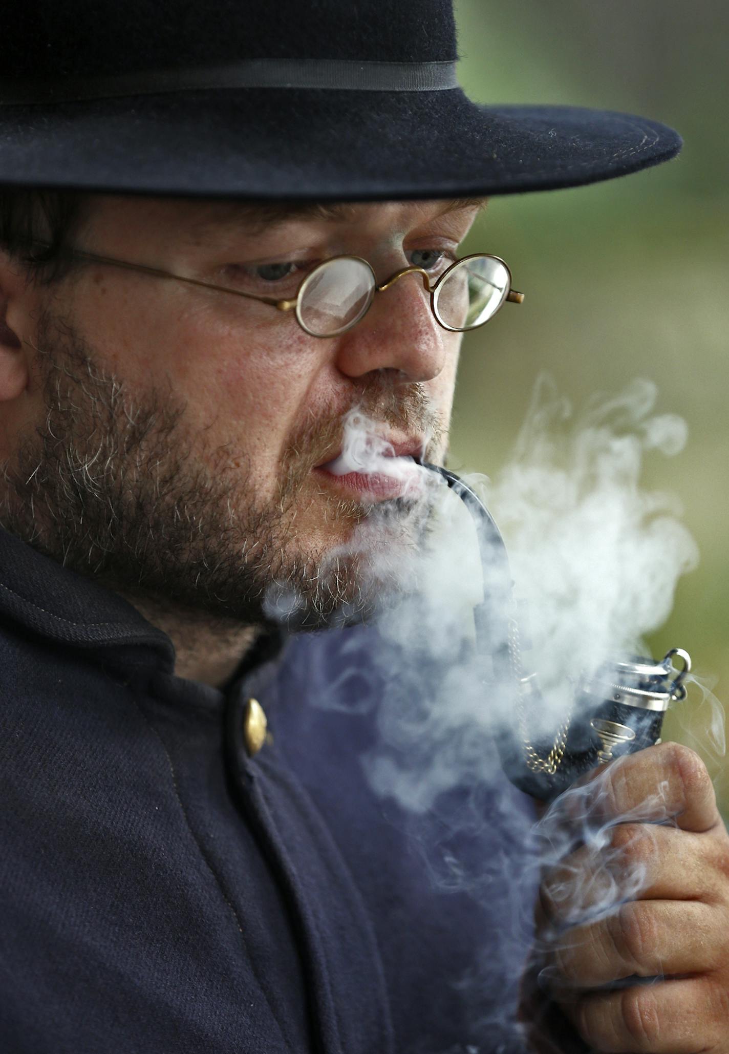 Dakota County's Civil War Weekend with educational demonstrations about Minnesota soldiers who served in the civil war. Gathering held at LeDuc Historic Estate in Hastings. Sargeant Shane (no last name given) of the 4th MN infantry lit up his pipe during a down time in Civil War preparations. (MARLIN LEVISON/STARTRIBUNE(mlevison@startribune.com)