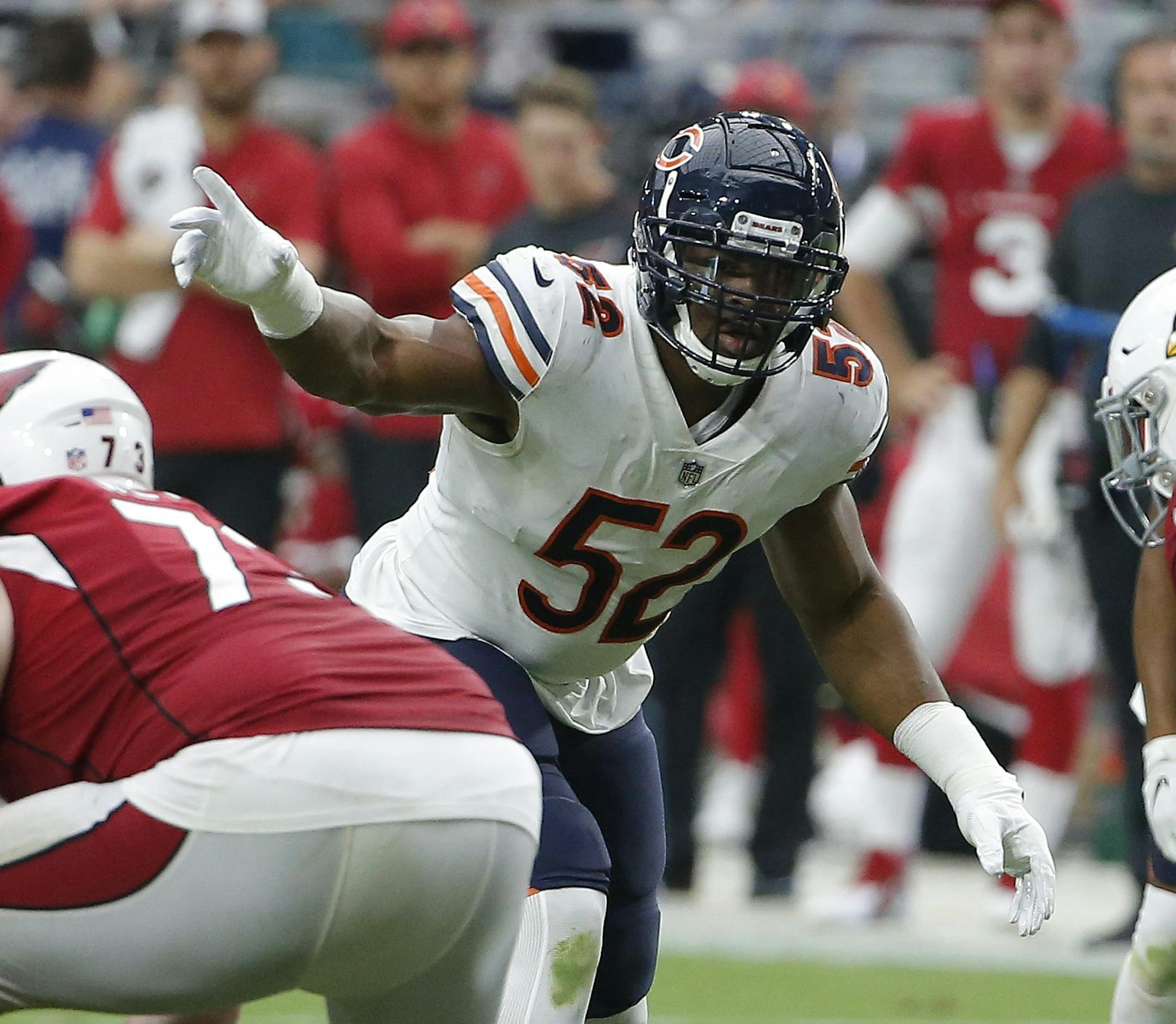 Chicago Bears linebacker Khalil Mack signals at the line of scrimmage during the second half of an NFL football game against the Arizona Cardinals, Sunday, Sept. 23, 2018, in Glendale, Ariz. (AP Photo/Rick Scuteri)