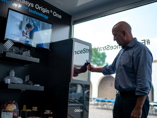 Stratasys, whose CEO Yoav Zeif is shown in the company’s mobile showroom in Eden Prairie, is a target in the consolidation within the 3-D printing i
