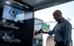 Stratasys, whose CEO Yoav Zeif is shown in the company’s mobile showroom in Eden Prairie, is a target in the consolidation within the 3-D printing i
