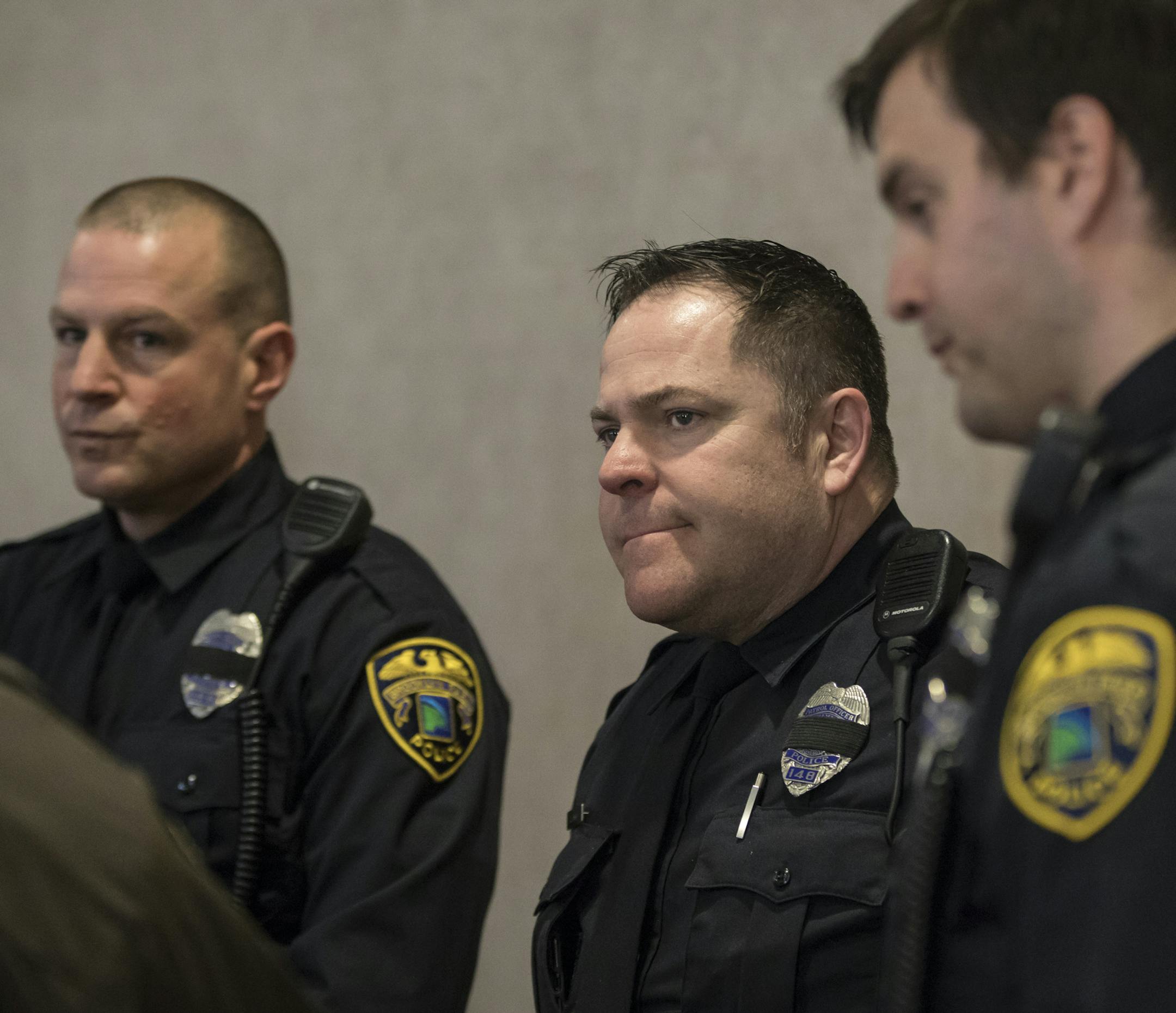 From the left; Brooklyn Park Officers Chad Miller, Todd Ewing, and Charlie Cudd chatted with guests at the visitation for their fellow Officer Andrew Suerth on Friday, December 15, 2017, in Brooklyn Park, Minn. The three men went out of their way to fly to Colorado and drive back this week with their fellow officer's remains. ] RENEE JONES SCHNEIDER • renee.jones@startribune.com