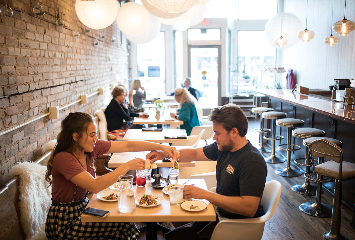 Heather Schultz and Ryan Ebhardt, both from Duluth, exchanged beef and chicken tacos during their date Wednesday night at Martha's Daughter. ] AARON LAVINSKY &#xef; aaron.lavinsky@startribune.com Annual food travel issue heads to Duluth, where a lot of new restaurants are popping up. We photograph restaurants and scenic Duluth on Wednesday, June 6 and Thursday, June 7, 2018.