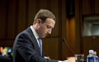 FILE- In this April 10, 2018, file photo Facebook CEO Mark Zuckerberg pauses while testifying before a joint hearing of the Commerce and Judiciary Com