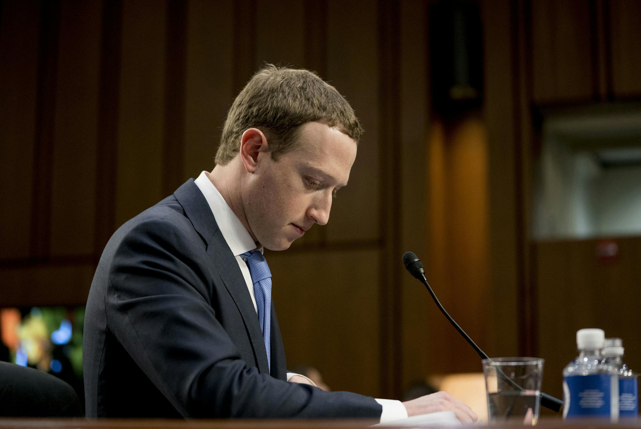 FILE- In this April 10, 2018, file photo Facebook CEO Mark Zuckerberg pauses while testifying before a joint hearing of the Commerce and Judiciary Committees on Capitol Hill in Washington about the use of Facebook data to target American voters in the 2016 election. The British Parliament has released some 250 pages worth of documents that show Facebook considered charging developers for data access. The documents show internal discussions about linking data to revenue. (AP Photo/Andrew Harnik,