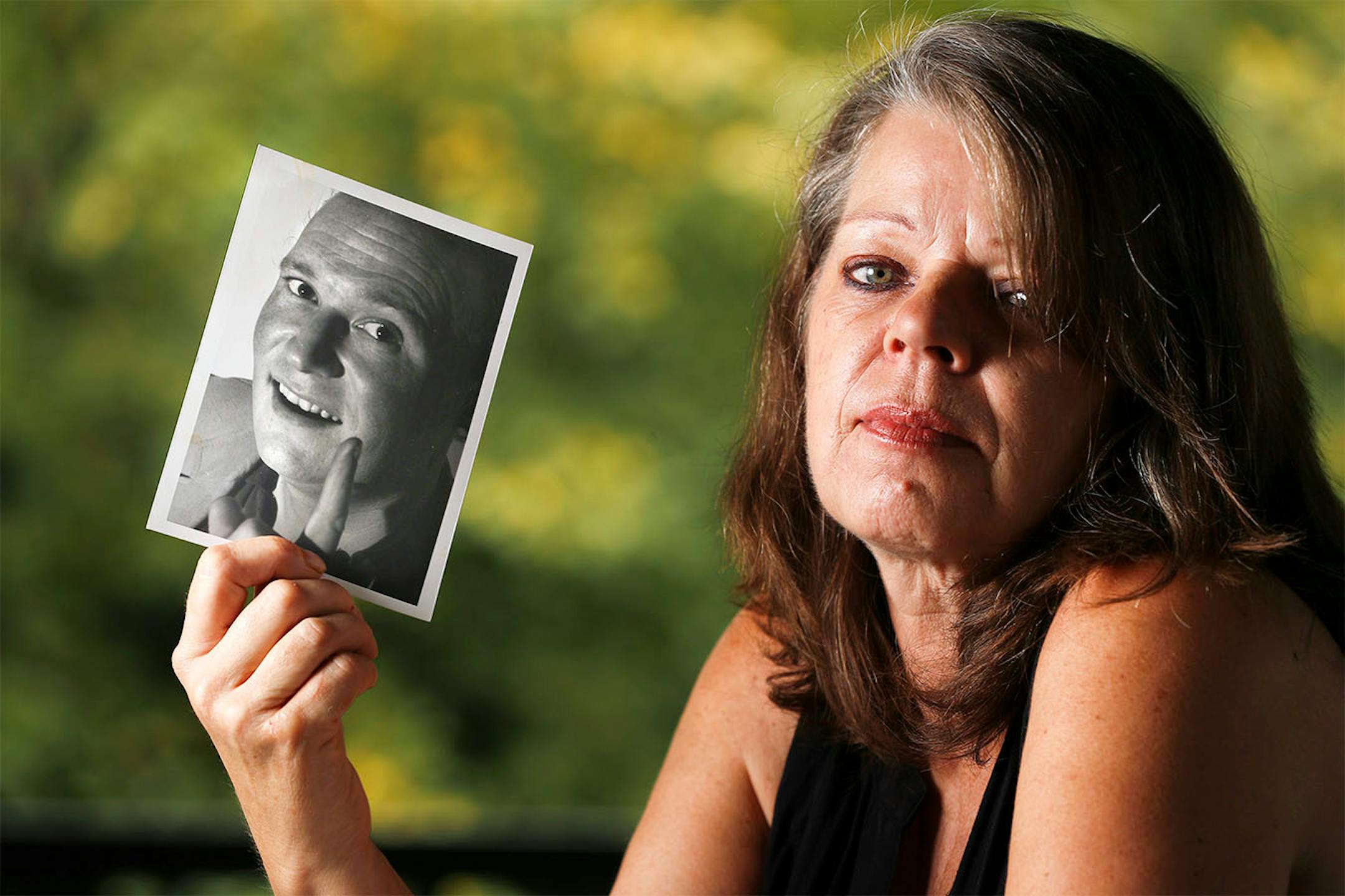 Barbara Behrend widow of Joseph Behrend held a photograph of her husband Monday August 15, 2016 in Delano, MN.