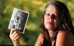 Barbara Behrend widow of Joseph Behrend held a photograph of her husband Monday August 15, 2016 in Delano, MN.