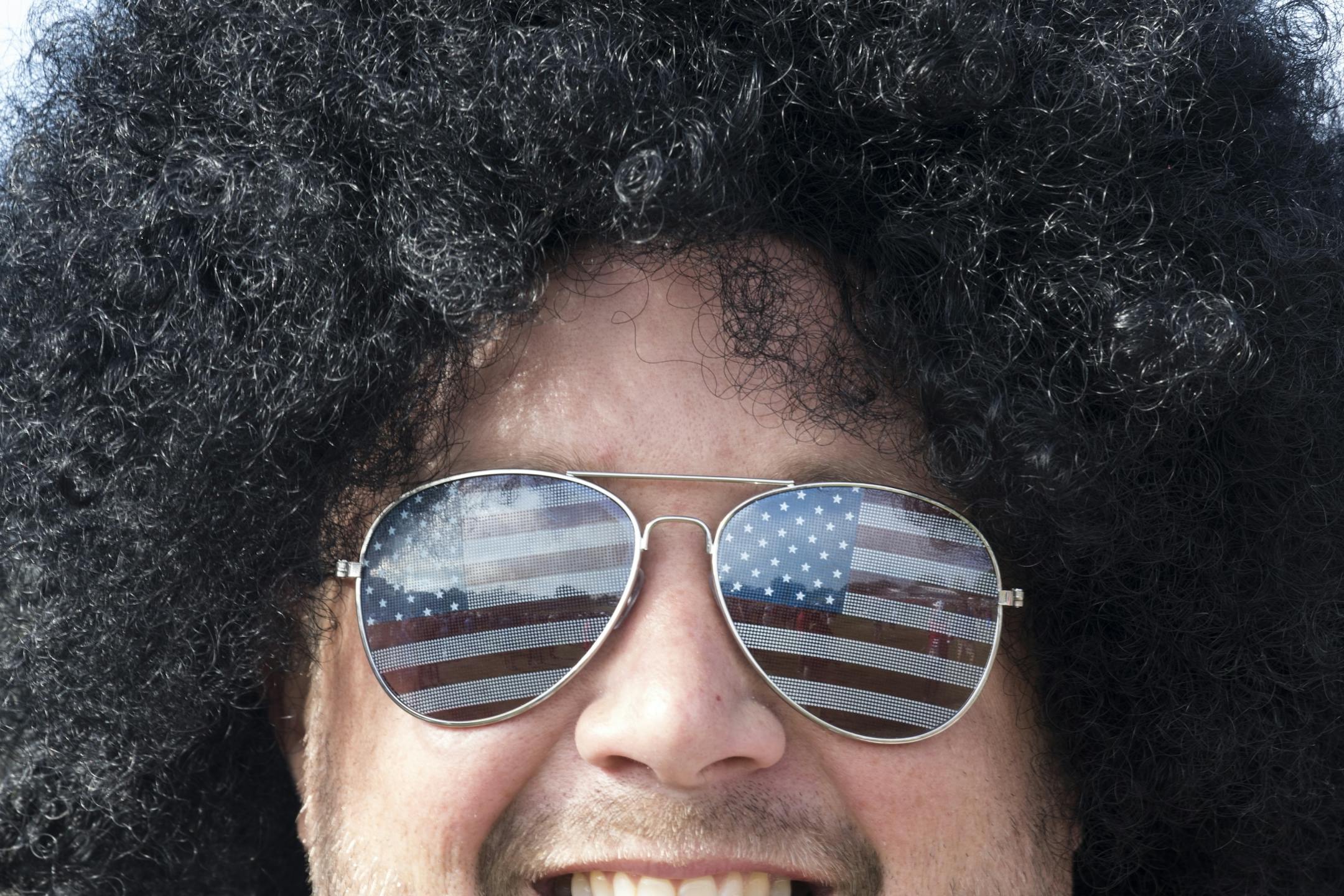Brandon Johnson from Brentwood, Ca. sports some patriotic sunglasses and a smile.