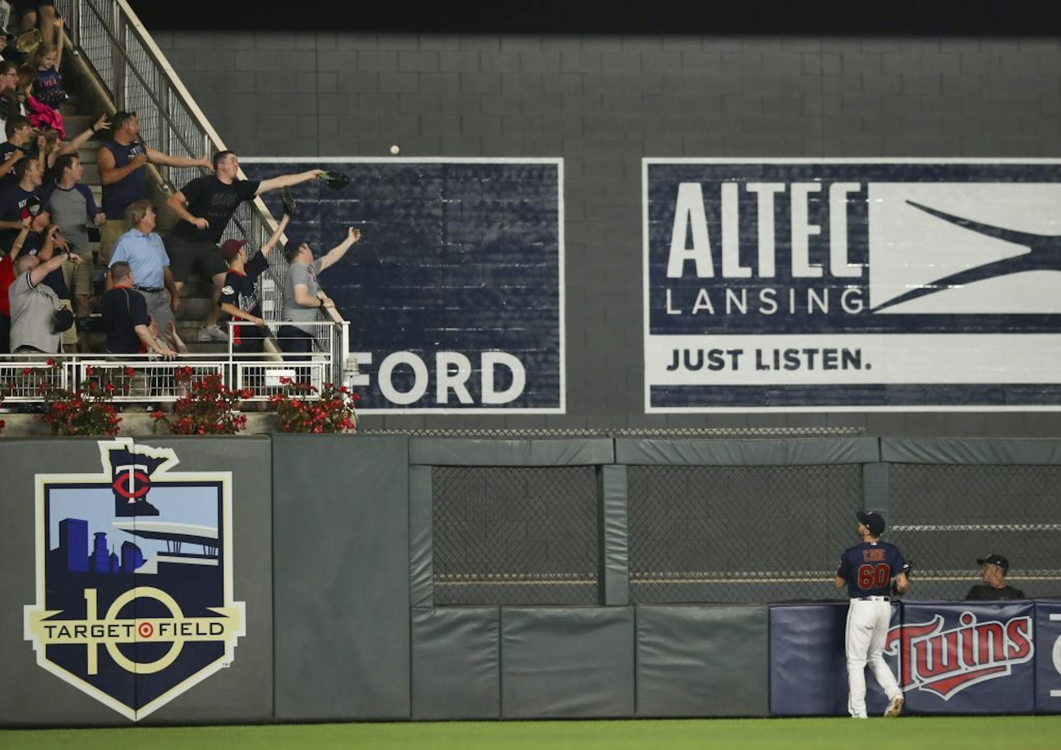 Minnesota Twins center fielder Jake Cave (60) watches the ball that New York Yankees designated hitter Edwin Encarnacion (30) knocked for a solo homer to left in the ninth inning.