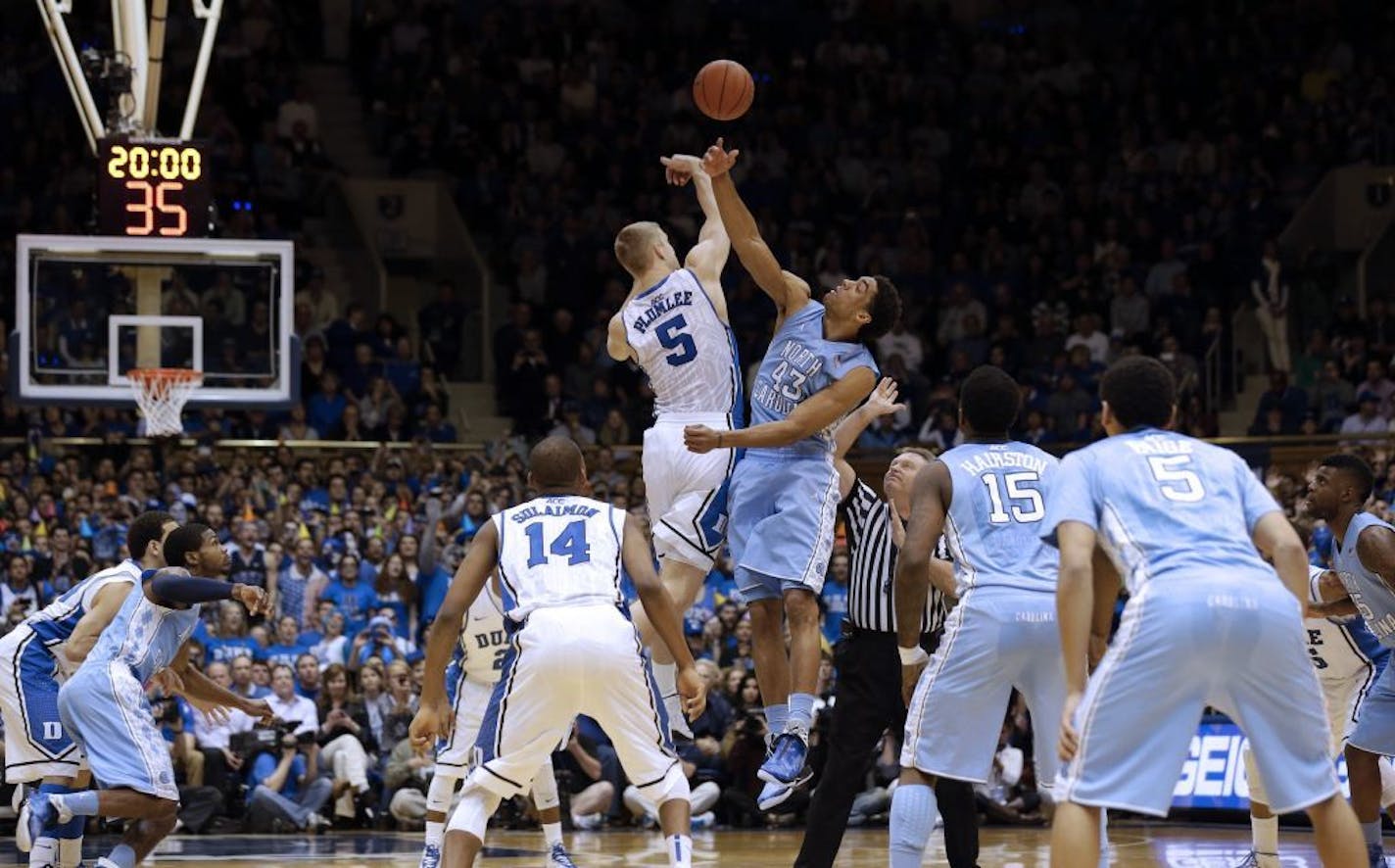 Duke's Mason Plumlee (5) and North Carolina's James Michael McAdoo (43) reach for the opening tip-off during the first half of an NCAA college basketball game in Durham, N.C., Wednesday, Feb. 13, 2013.