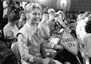 FILE - In this Aug. 10, 1976, file photo, women opposed to the Equal Rights Amendment sit with Phyllis Schlafly, left, national chairman of Stop ERA, 