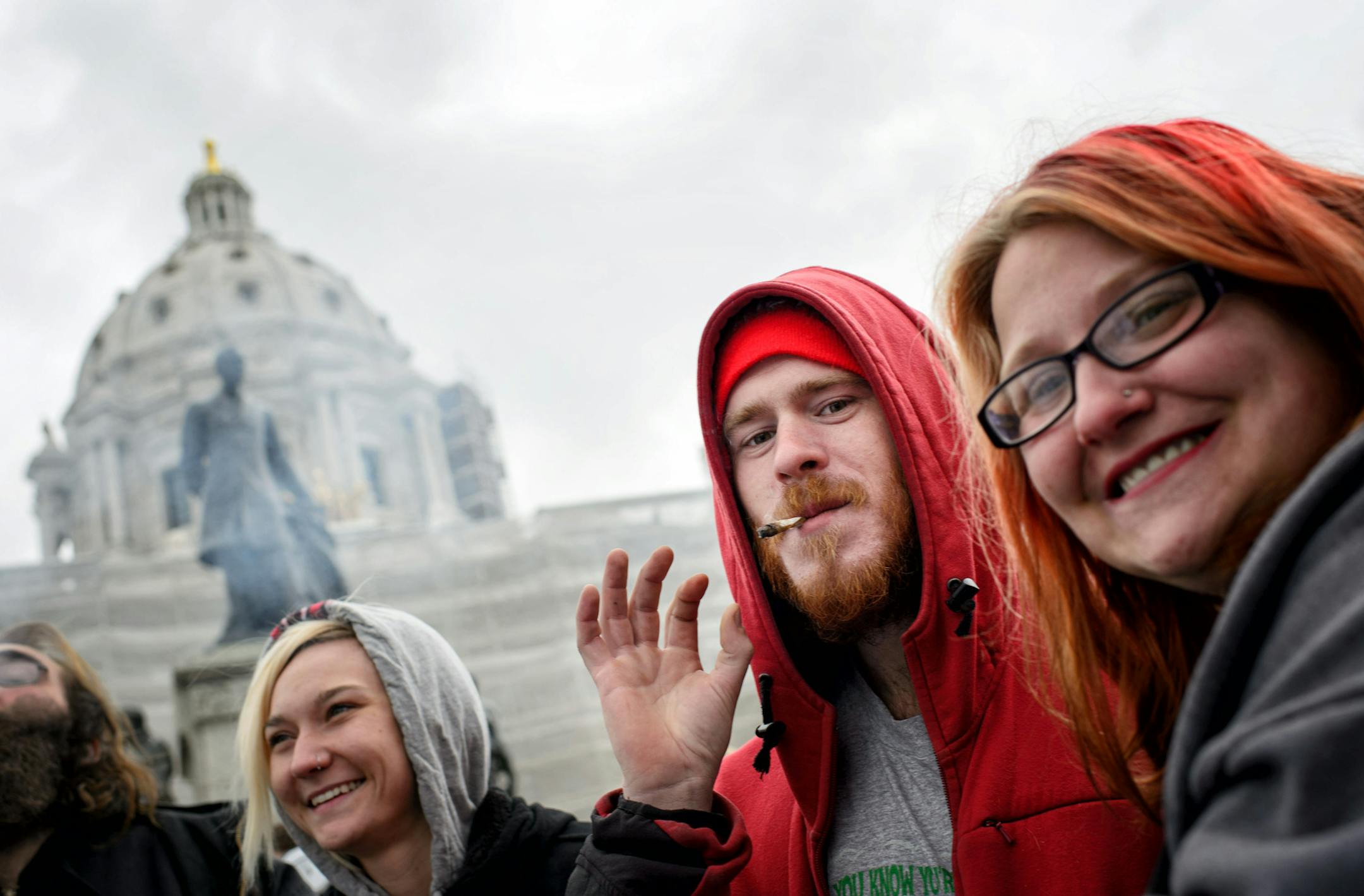 Justin Murphy and Jessy McGhee were among hundreds of people smoked marijuana in front of the State Capitol at 4:20 p.m. Monday at the Yes, We Cannabis rally for the full legalization of cannabis in Minnesota. ] GLEN STUBBE * gstubbe@startribune.com Monday, April 20, 2015 Hundreds of people smoked marijuana in front of the State Capitol at 4:20 p.m. Monday at the Yes, We Cannabis rally for the full legalization of cannabis in Minnesota.