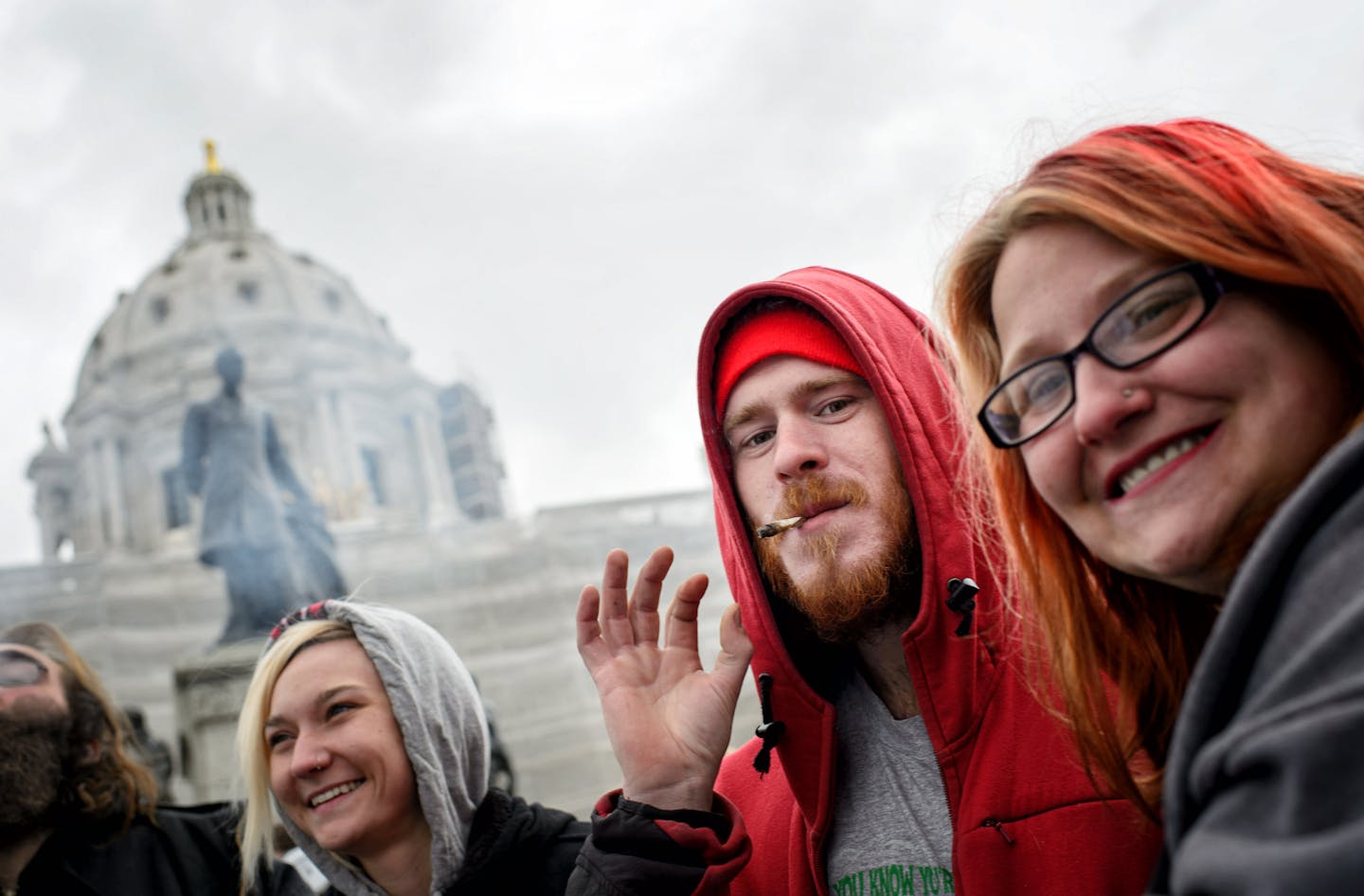 Justin Murphy and Jessy McGhee were among hundreds of people smoked marijuana in front of the State Capitol at 4:20 p.m. Monday at the Yes, We Cannabis rally for the full legalization of cannabis in Minnesota. ] GLEN STUBBE * gstubbe@startribune.com Monday, April 20, 2015 Hundreds of people smoked marijuana in front of the State Capitol at 4:20 p.m. Monday at the Yes, We Cannabis rally for the full legalization of cannabis in Minnesota.