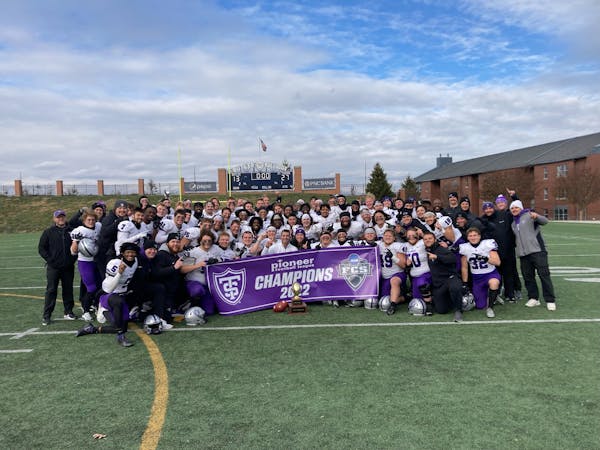 Tommies players celebrated their Pioneer Football League championship Saturday in Indianapolis following their 27-13 victory at Butler.
