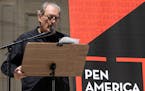 American writer Paul Auster speaks during a reading event in solidarity of support for author Salman Rushdie outside the New York Public Library, Aug.